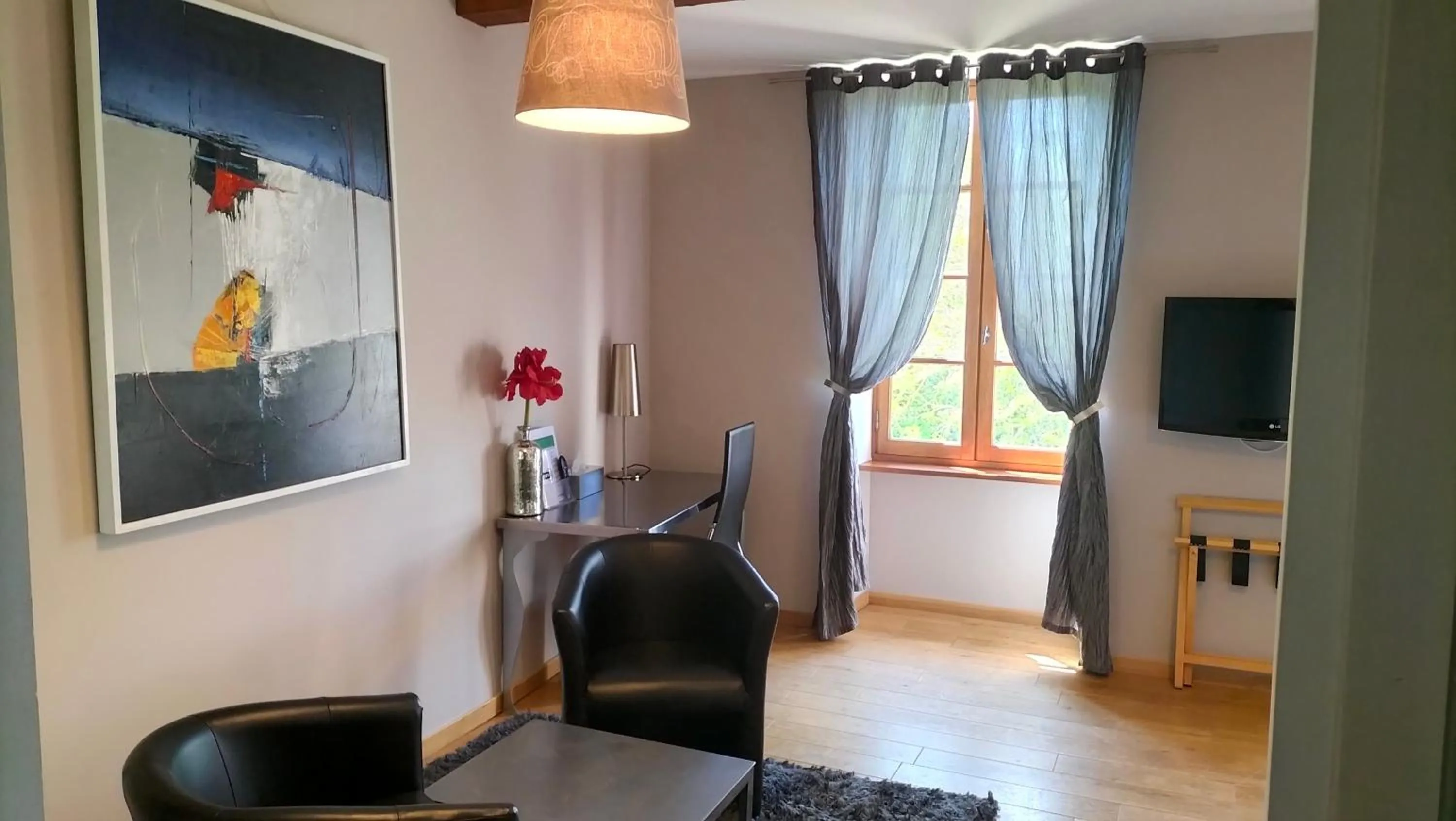 Bedroom in Logis Hôtel Château De Palaja