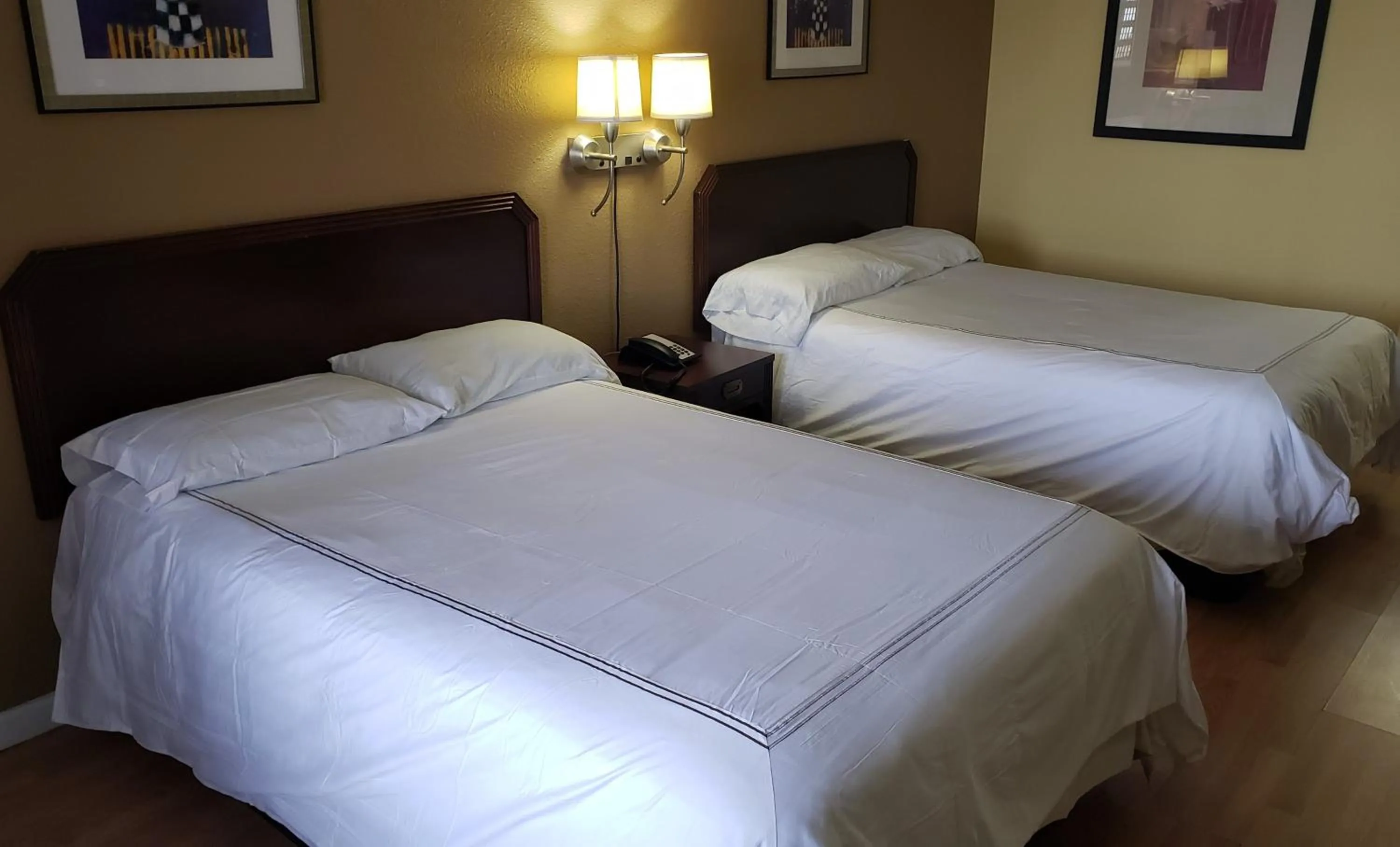 Bed in West Texas Inn & Suites with Kitchenette