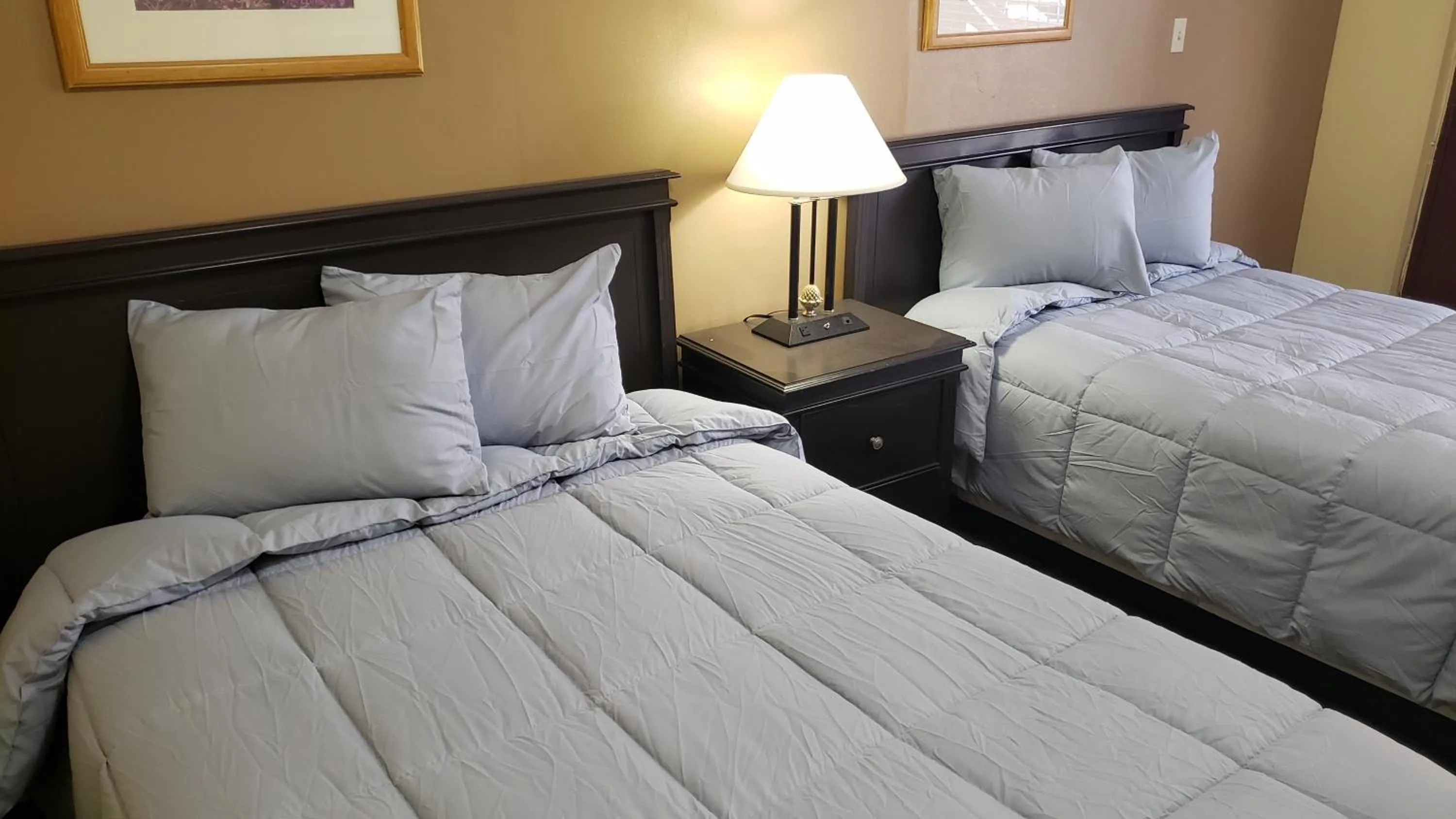 Bed in West Texas Inn & Suites with Kitchenette