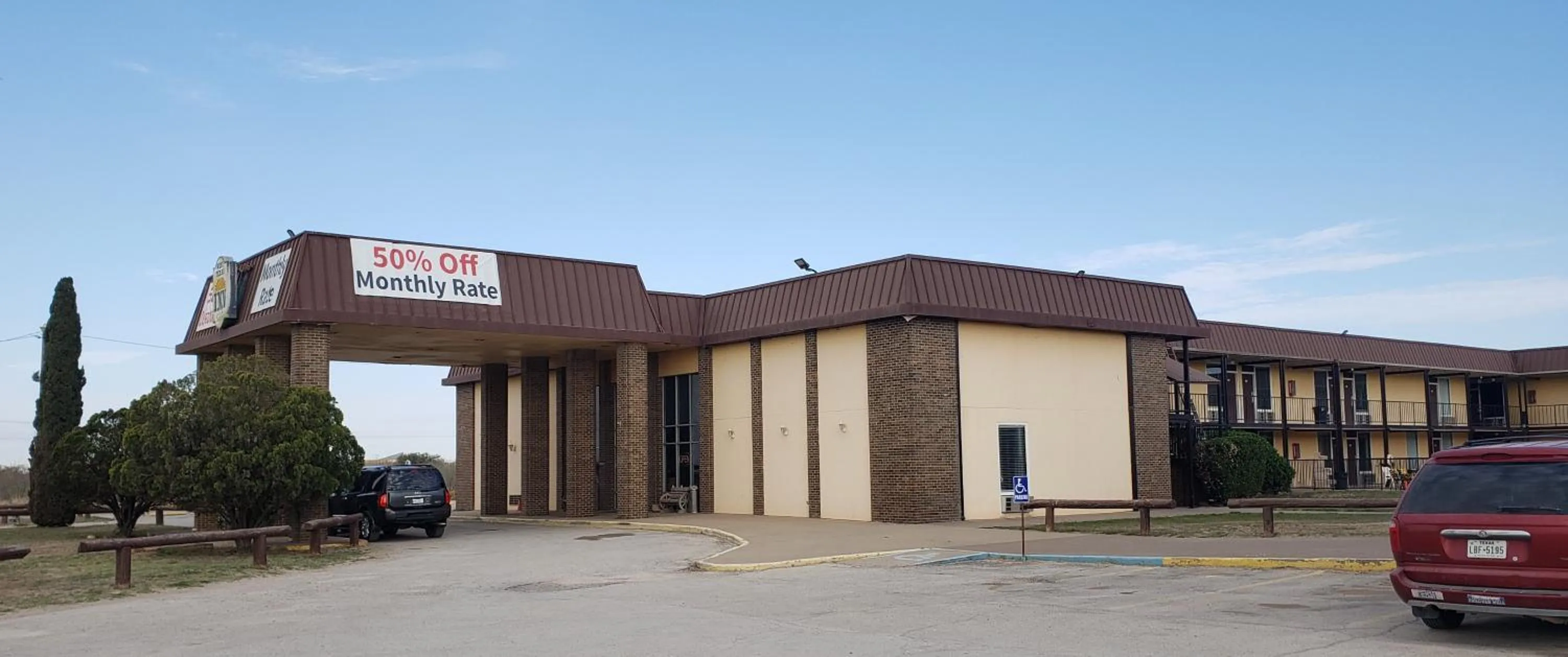 Property building in West Texas Inn & Suites with Kitchenette