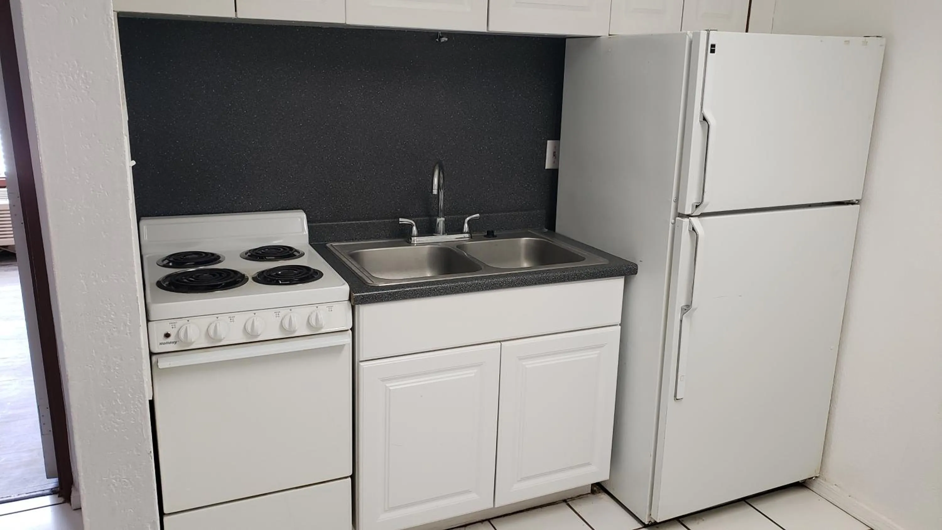 Kitchen or kitchenette in West Texas Inn & Suites with Kitchenette