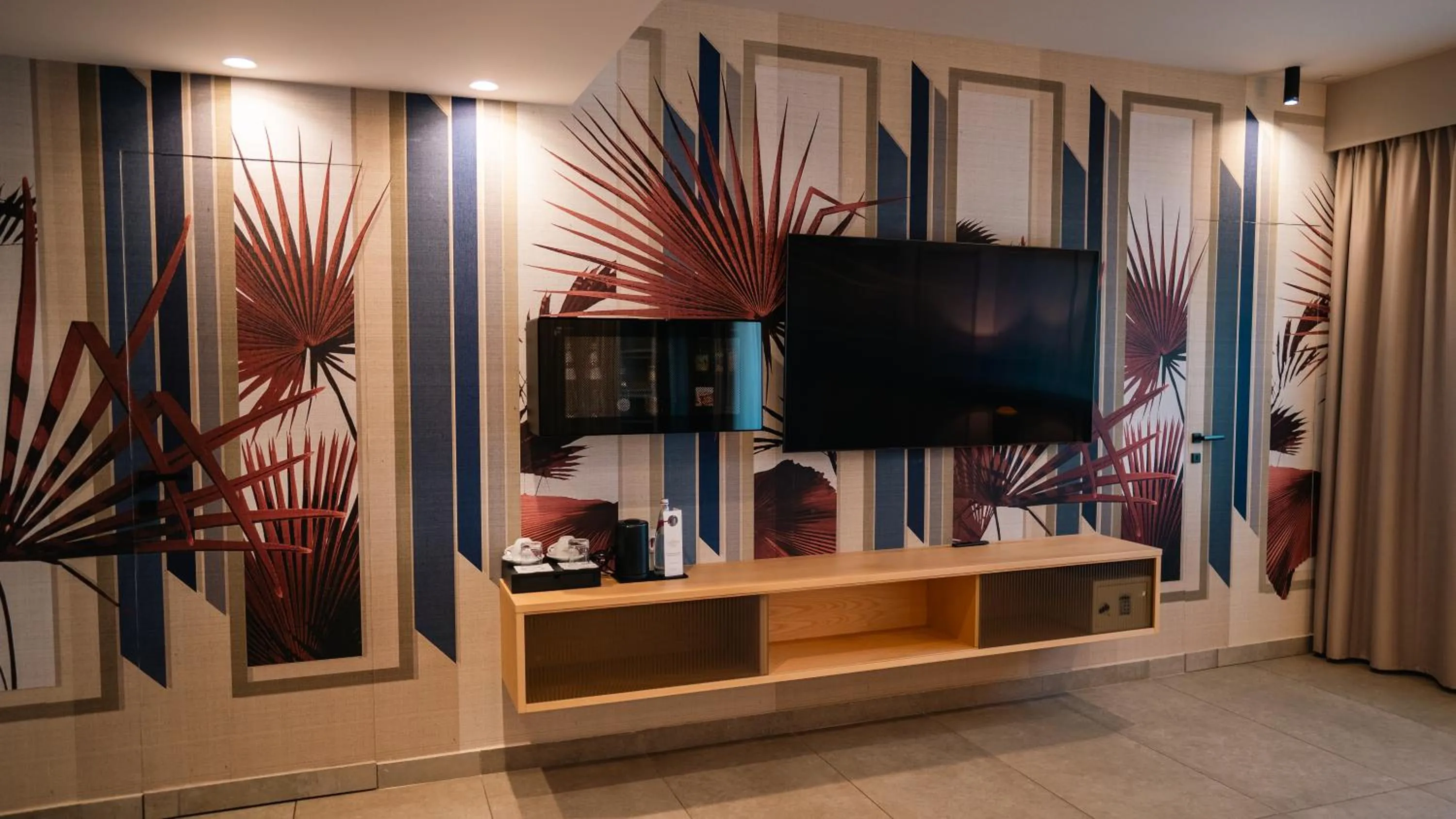 Communal lounge/ TV room in Altafiumara Resort & Spa