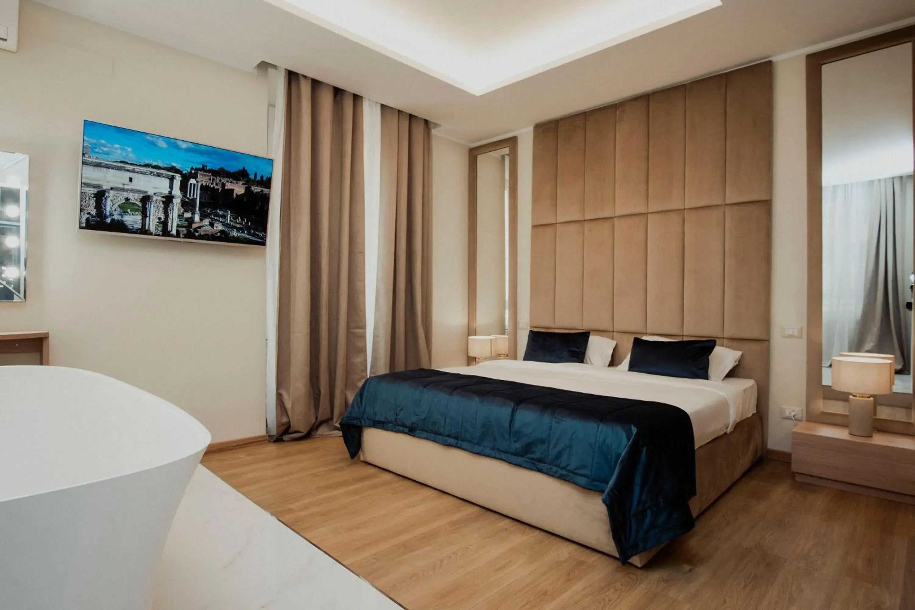 Bed in Cesare ai Cavalieri Suites Bed in Cesare ai Cavalieri Suites