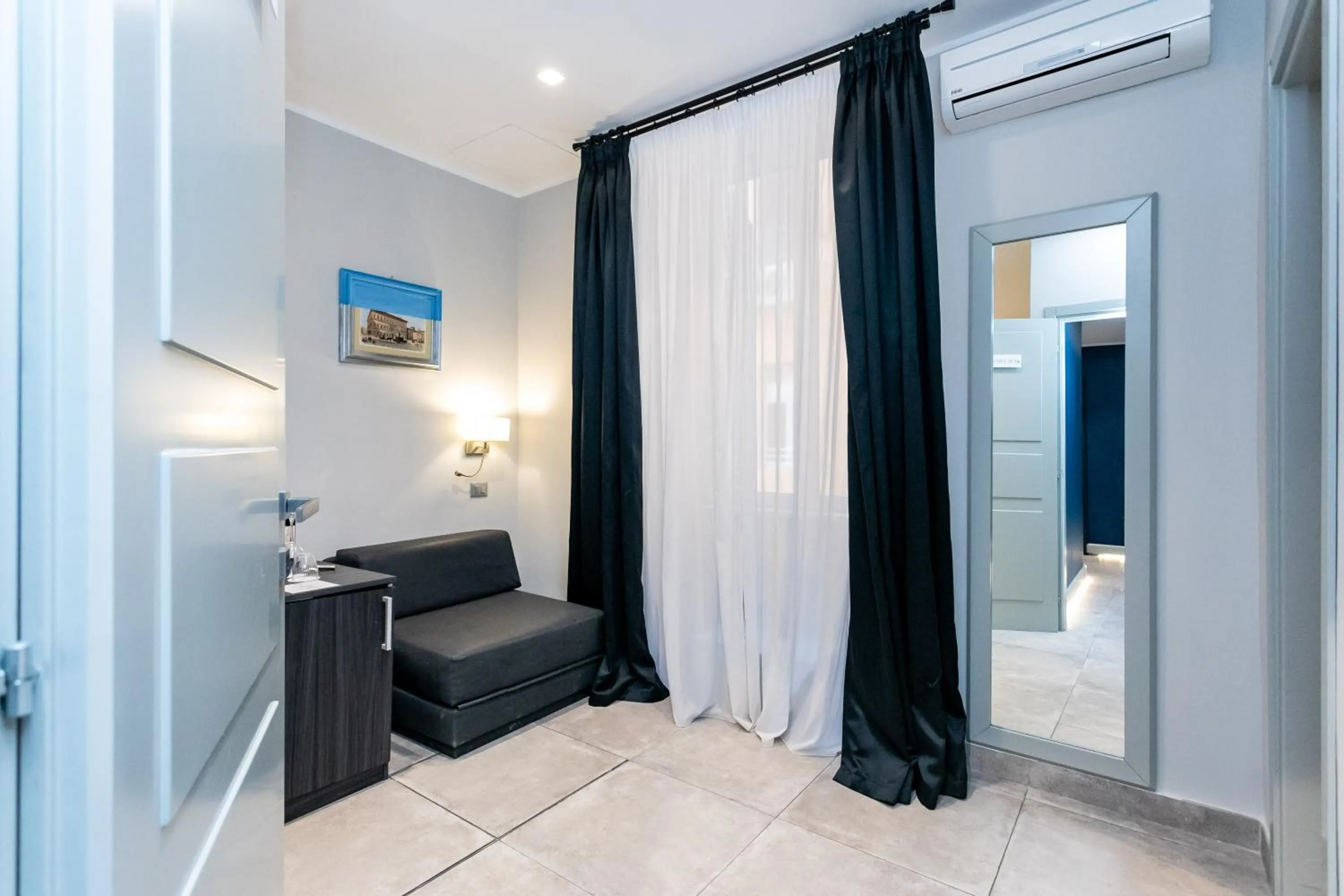 Living room, Bed in Cesare ai Cavalieri Suites