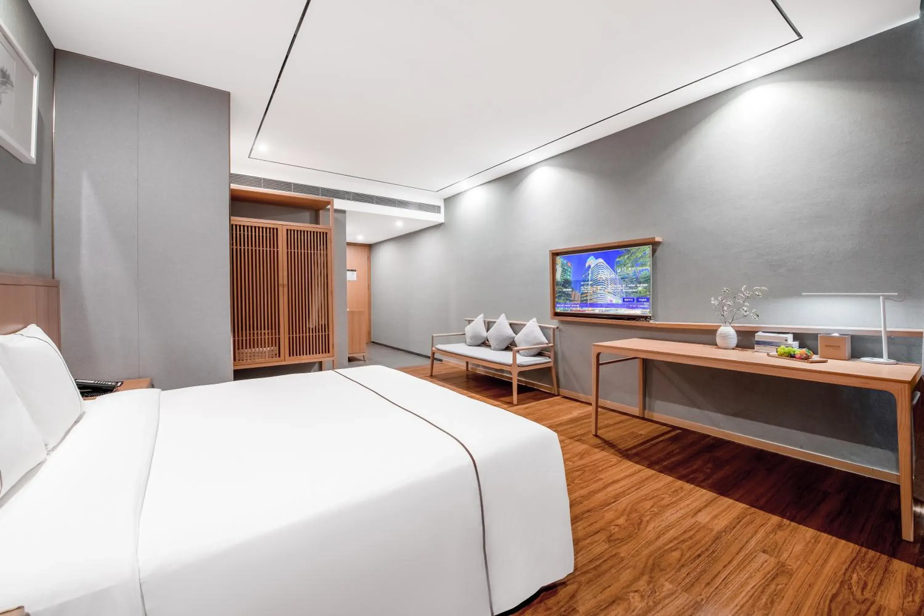 Bed, TV/Entertainment Center in H' Elite Hotel