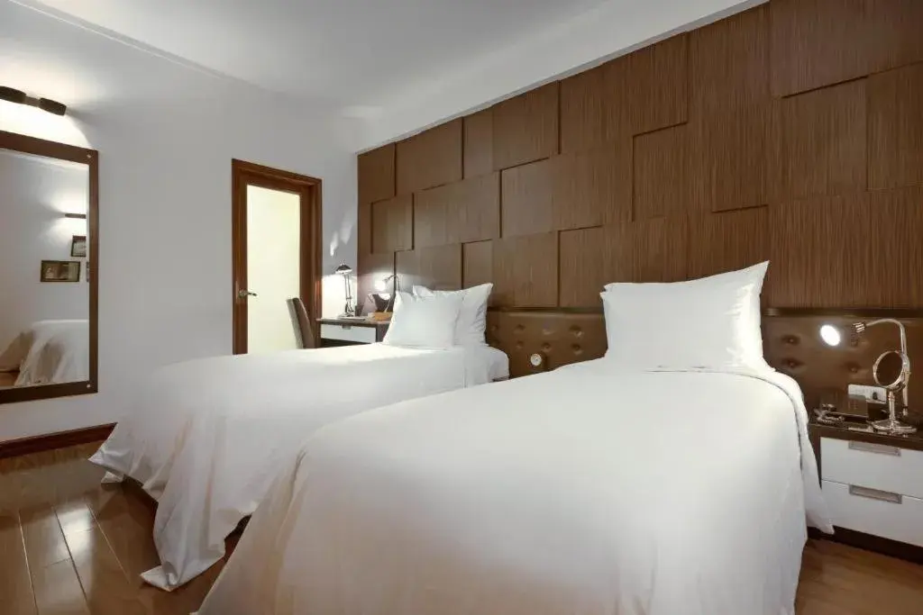 Bed in La Nueva Boutique Hotel Hanoi & Spa Bed in La Nueva Boutique Hotel Hanoi & Spa