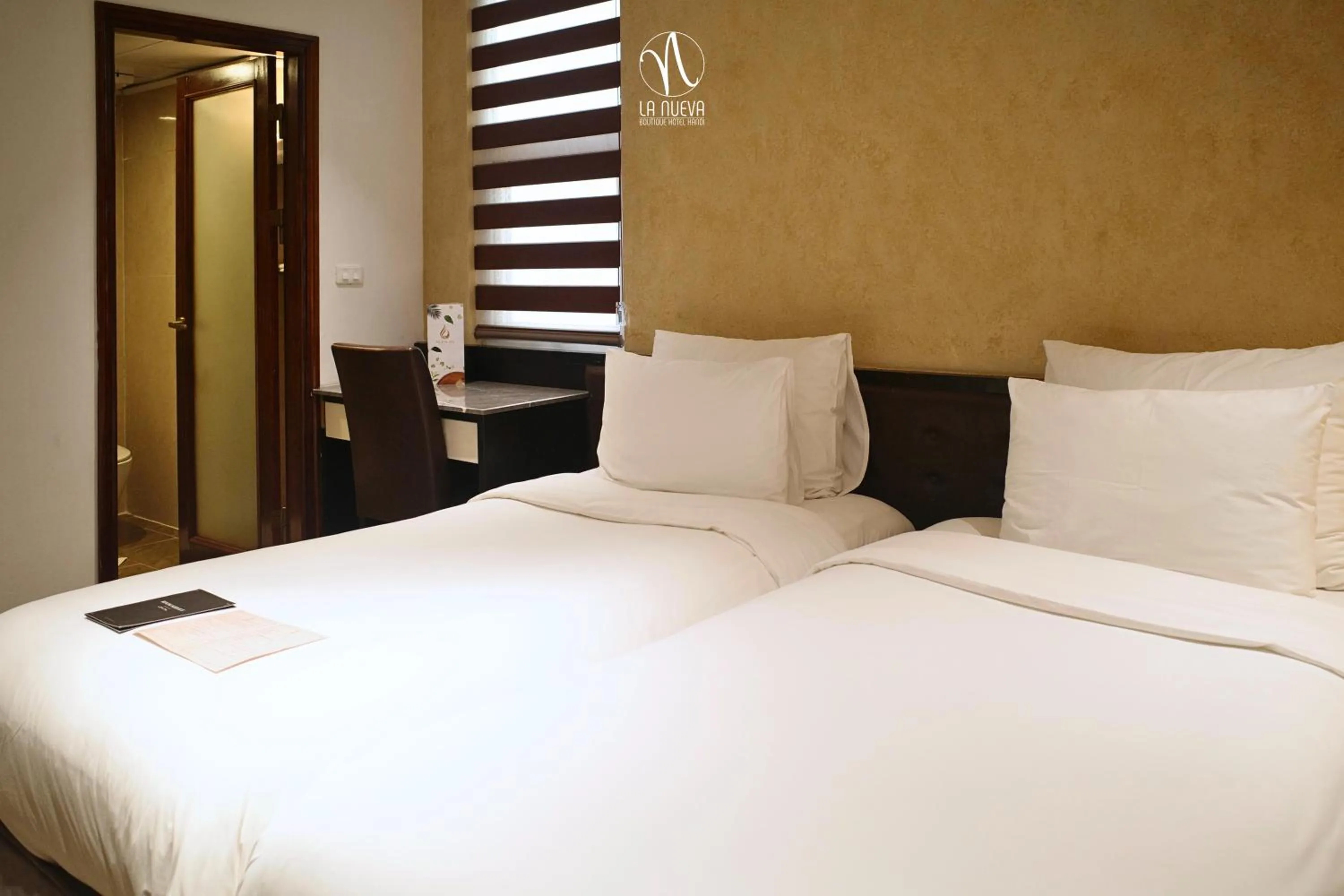 Bed in La Nueva Boutique Hotel Hanoi & Spa