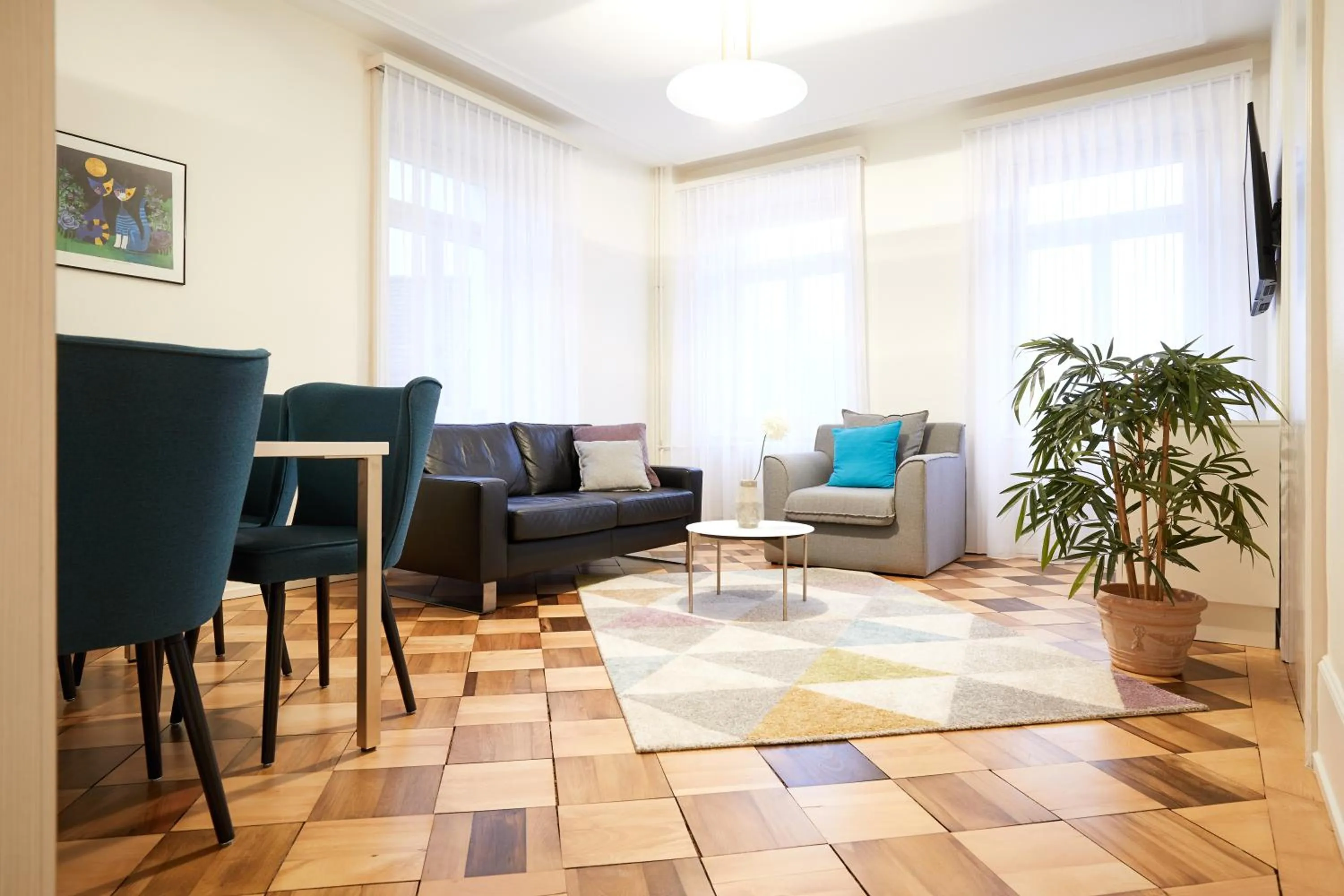 Communal lounge/ TV room in Hotel Schmid & Alfa