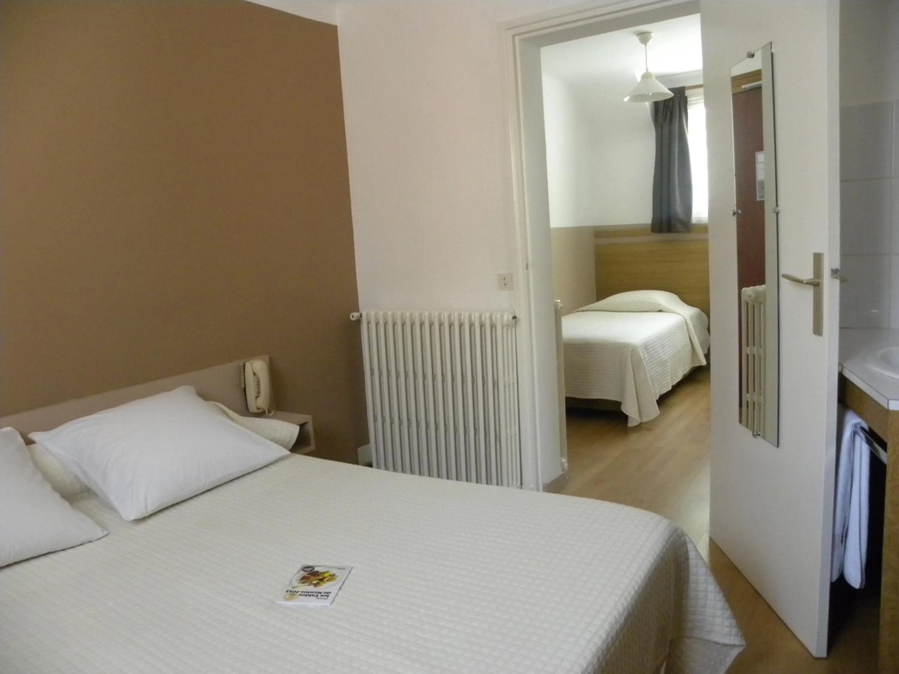 Photo of the whole room, Bed in Hôtel Le Cambronne