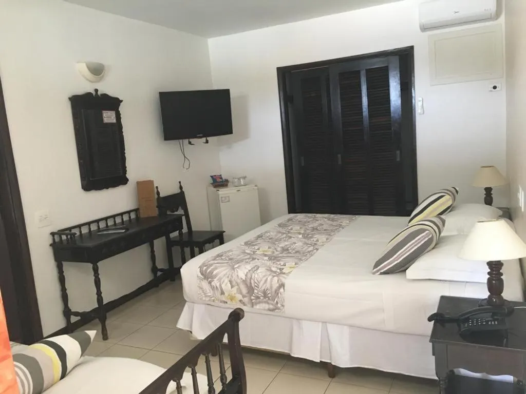 Photo of the whole room, Bed in Ubatuba Palace Hotel