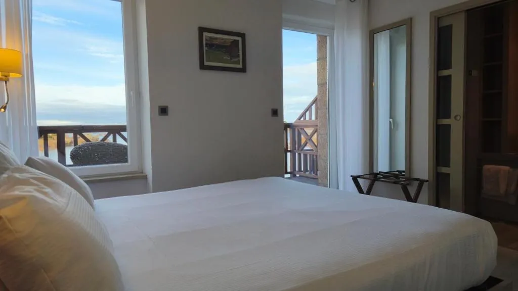 Photo of the whole room, Bed in Logis Hôtel Saint Guirec Et De La Plage