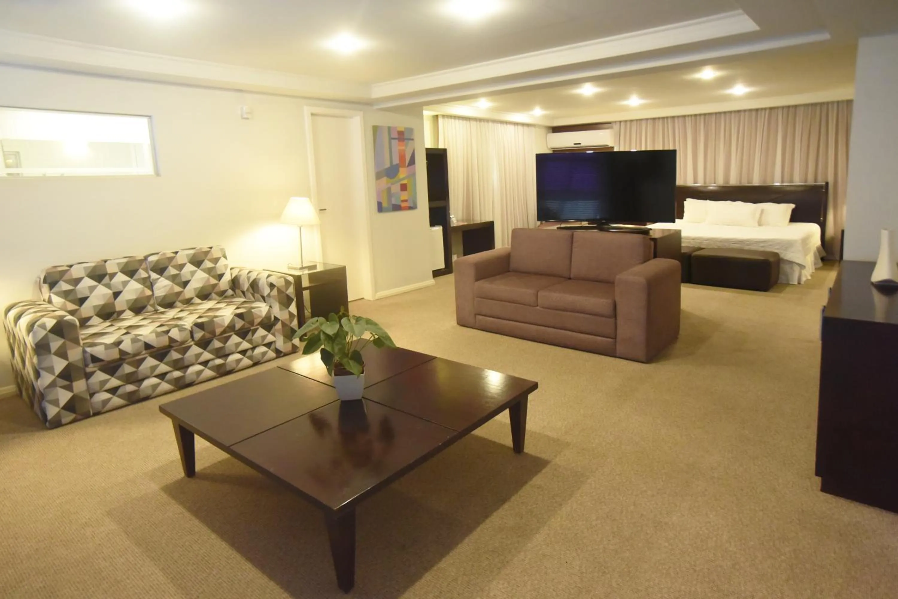 Communal lounge/ TV room, Bed in Central Park Hotel by Bourbon