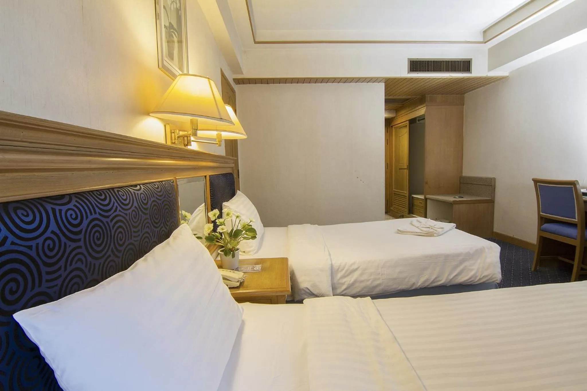 Bed in Bossotel Chiang Mai