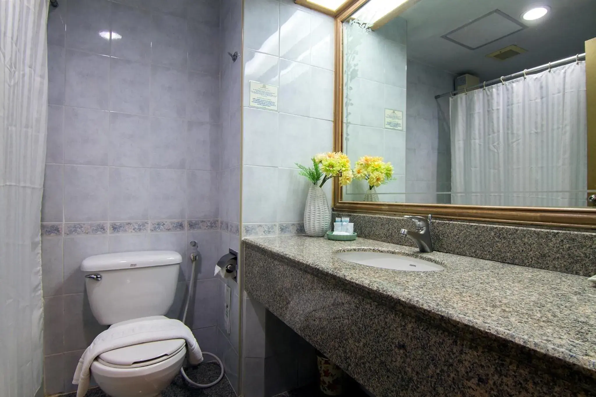 Bathroom in Bossotel Chiang Mai Bathroom in Bossotel Chiang Mai