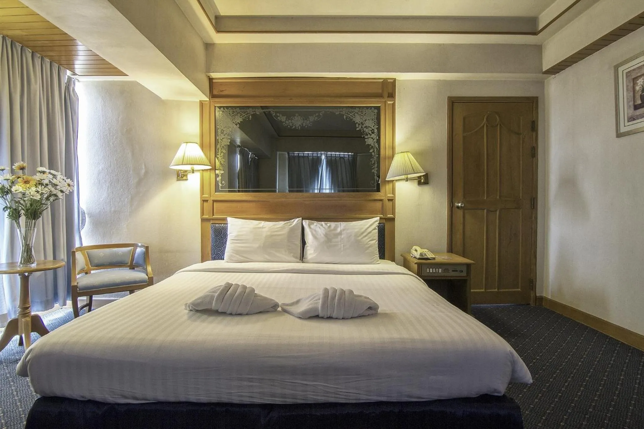 Bed in Bossotel Chiang Mai