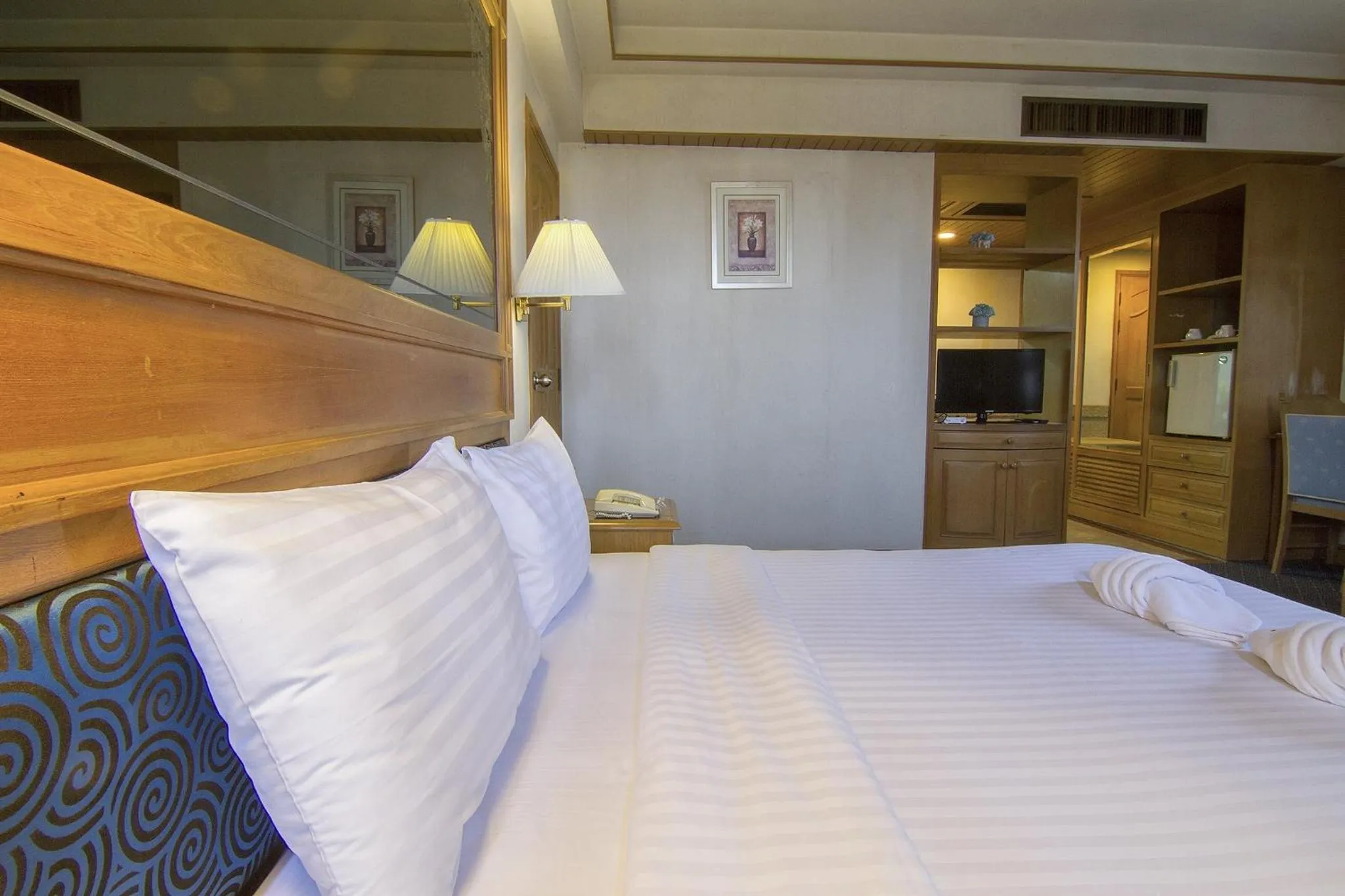 Bed in Bossotel Chiang Mai