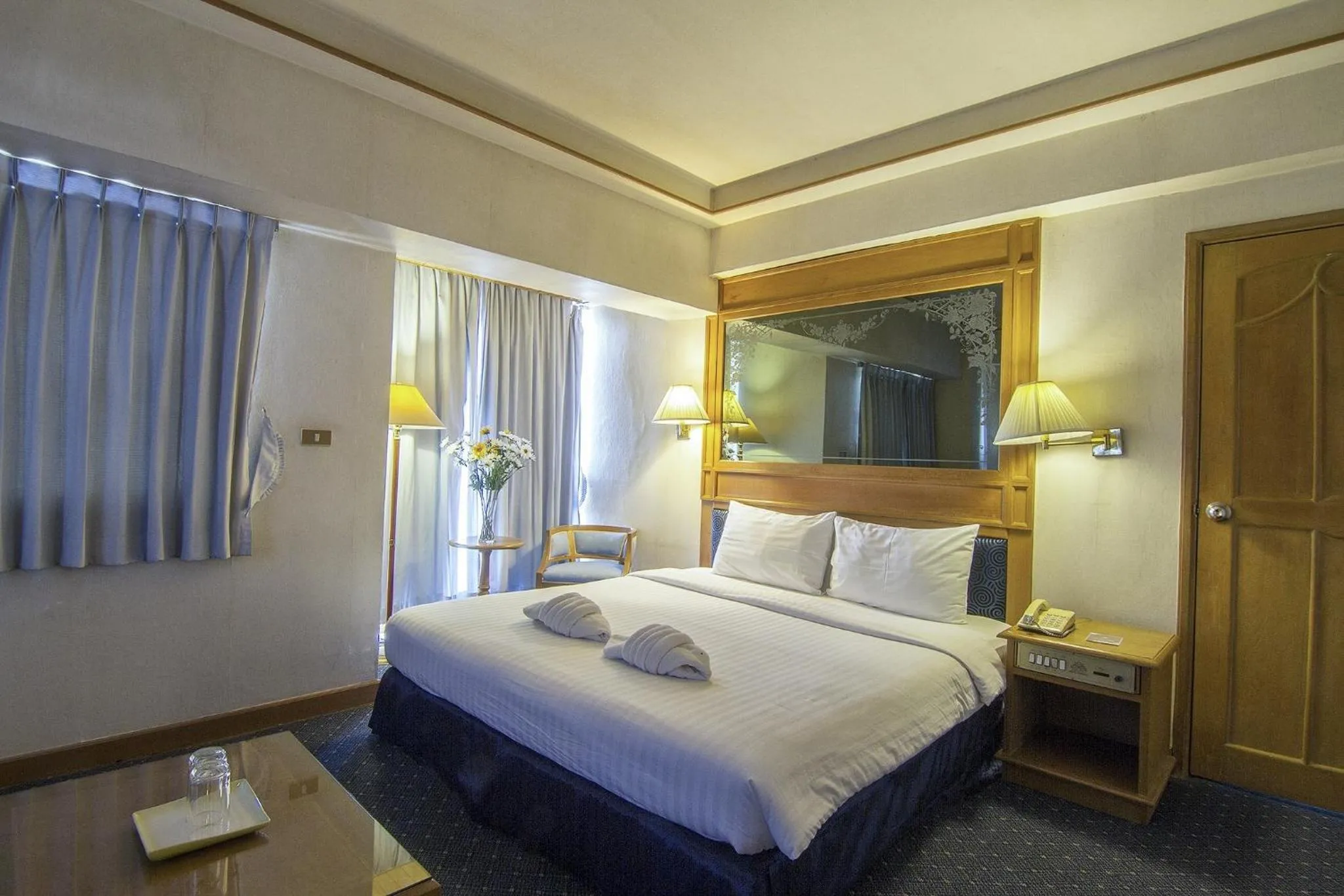 Bed in Bossotel Chiang Mai