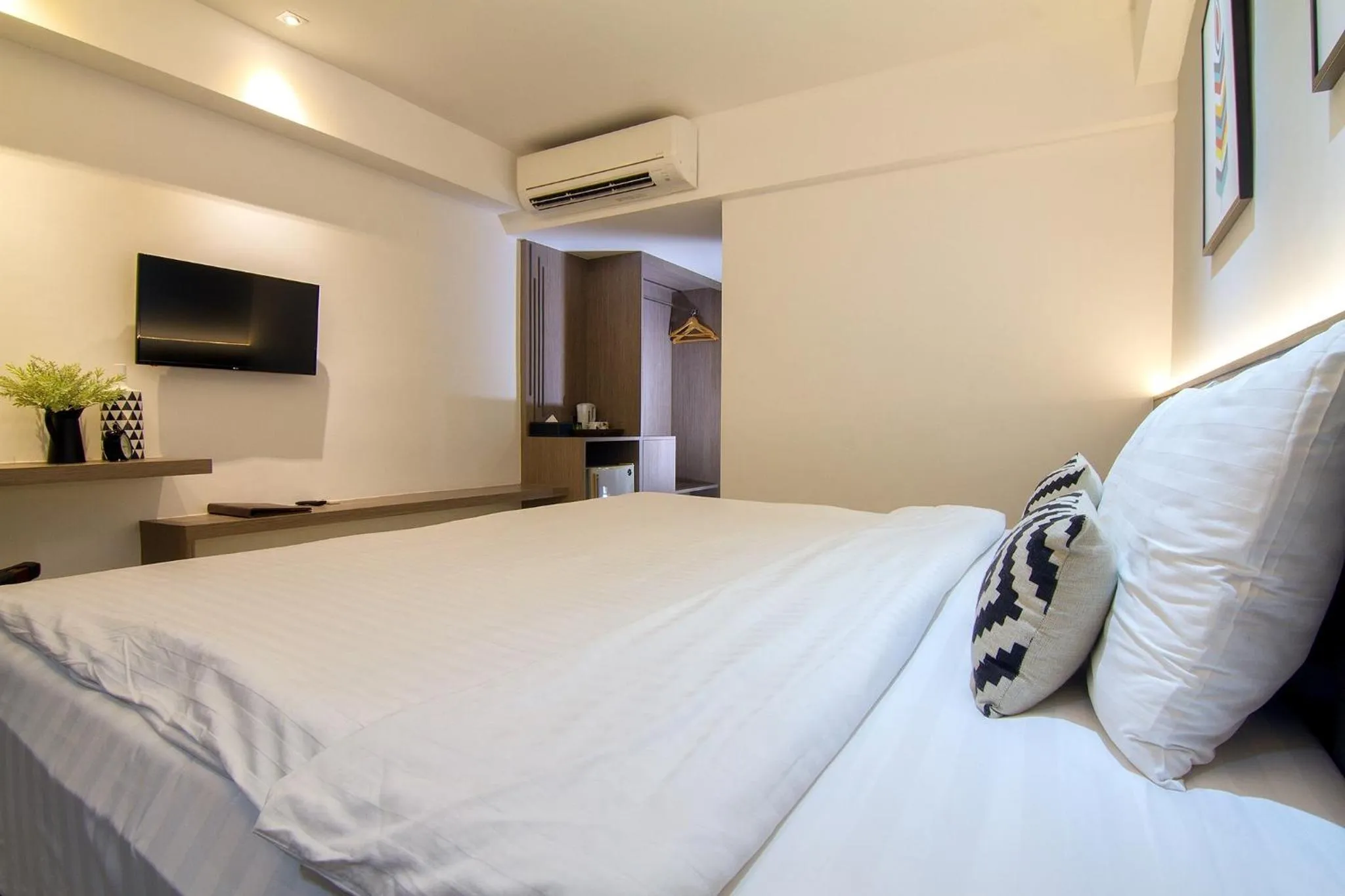 Bed in Bossotel Chiang Mai