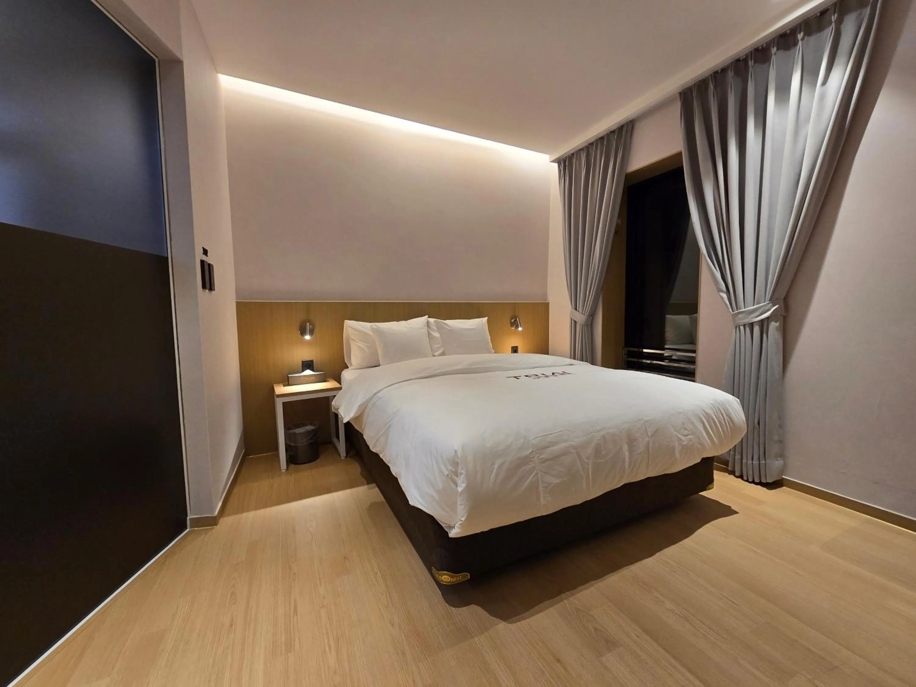Bed in Tria Business & Boutique Hotel