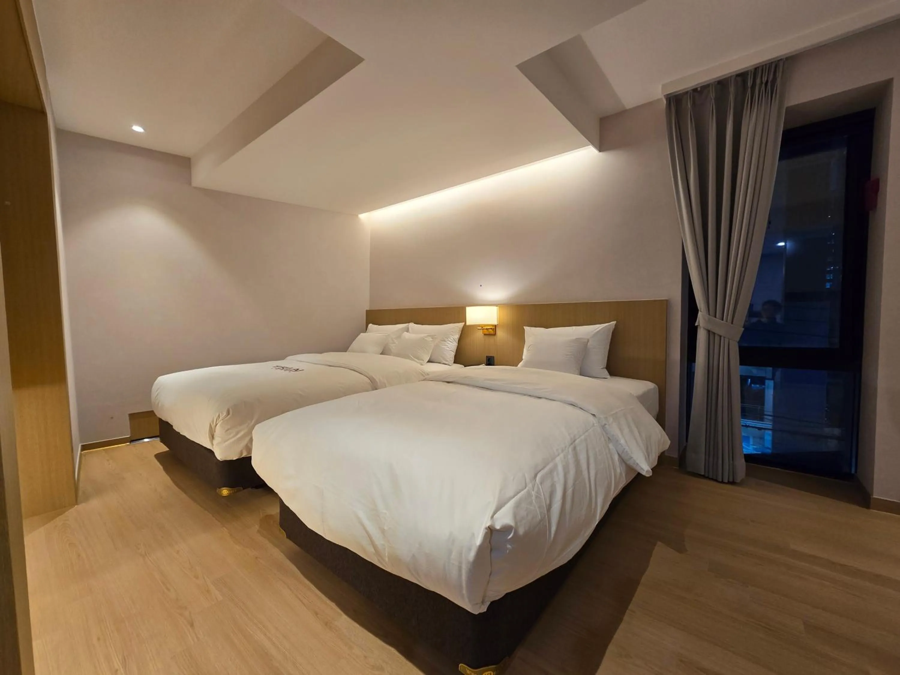 Bed in Tria Business & Boutique Hotel