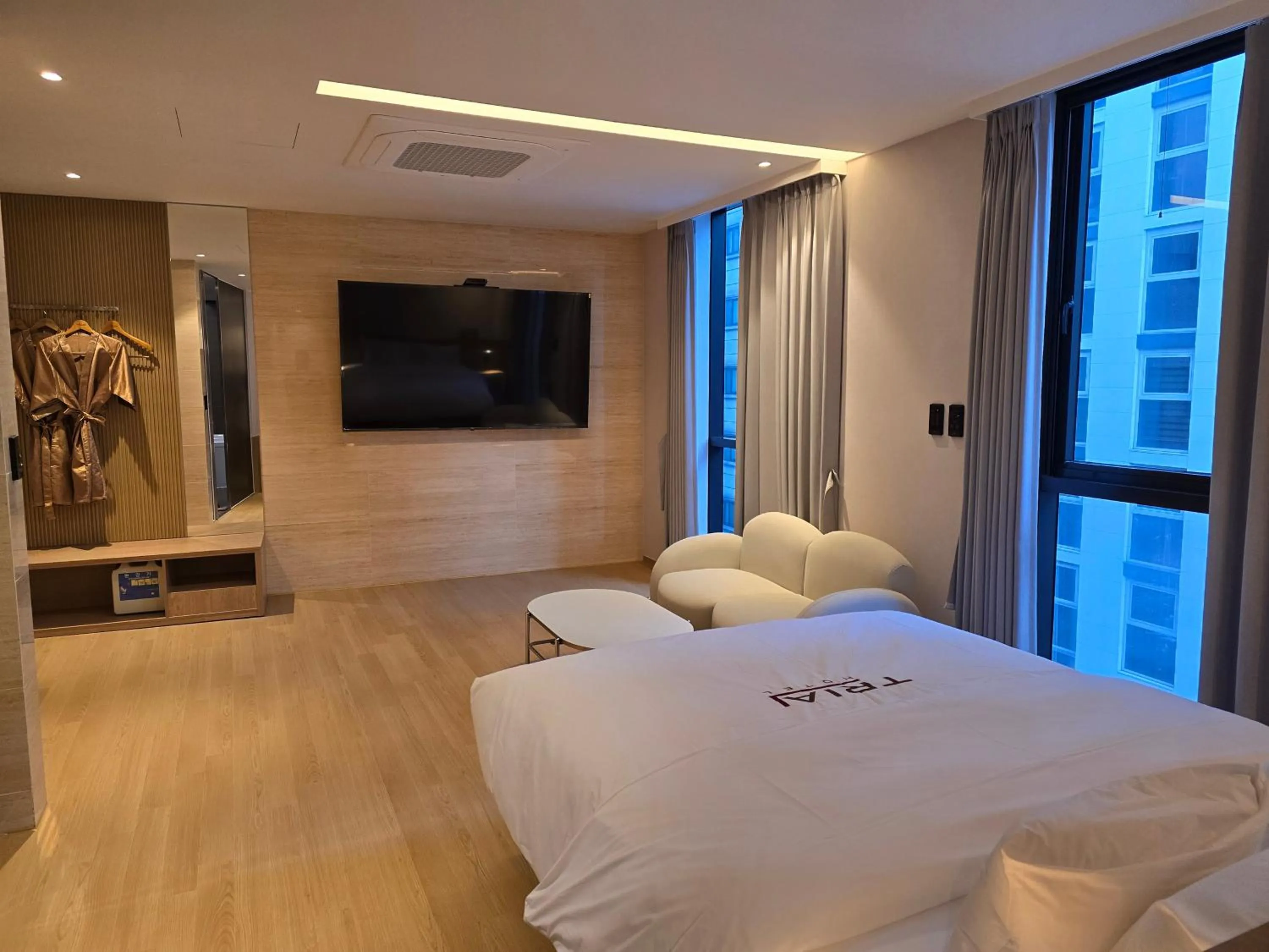 Bed in Tria Business & Boutique Hotel