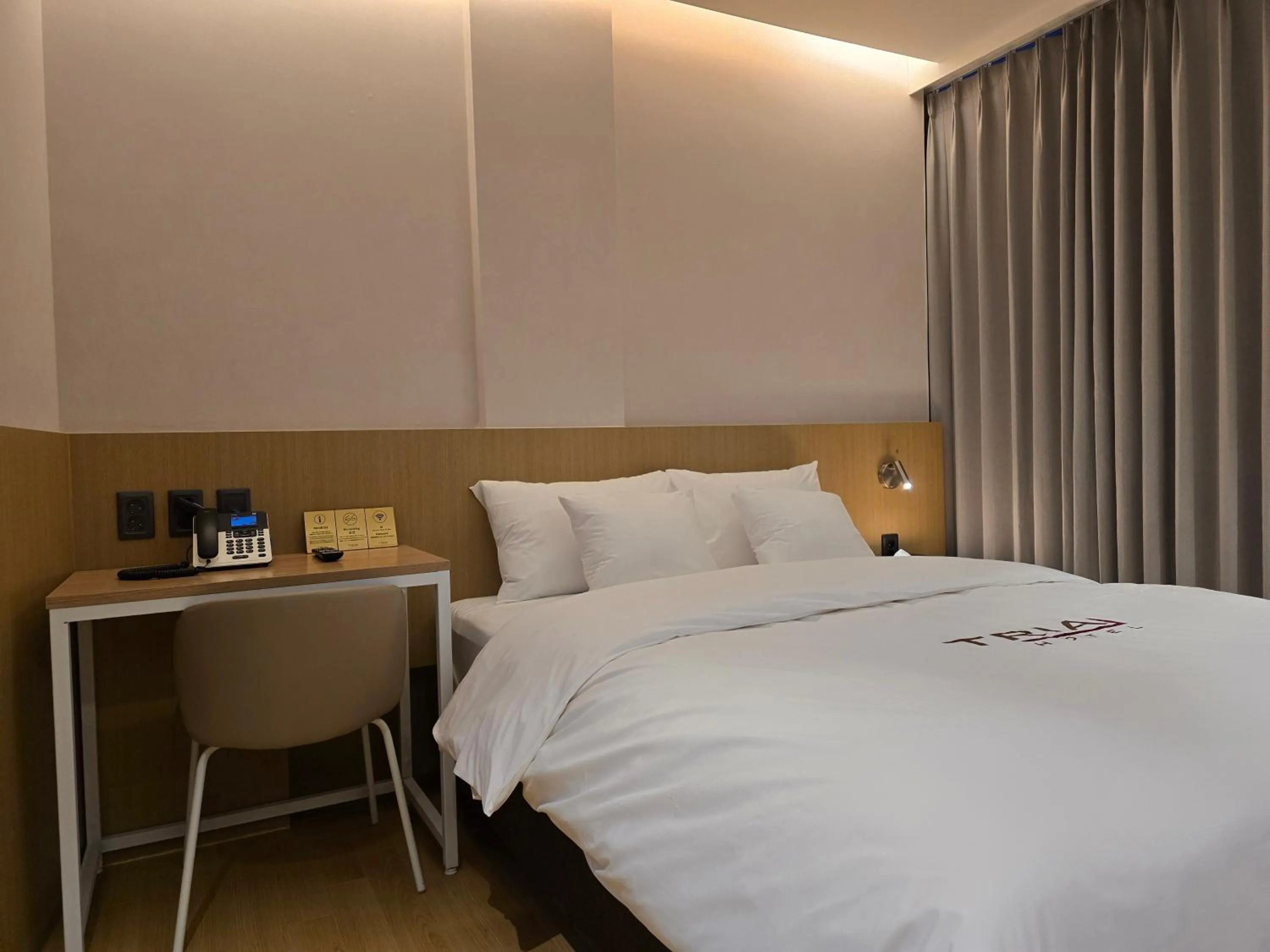 Bed in Tria Business & Boutique Hotel