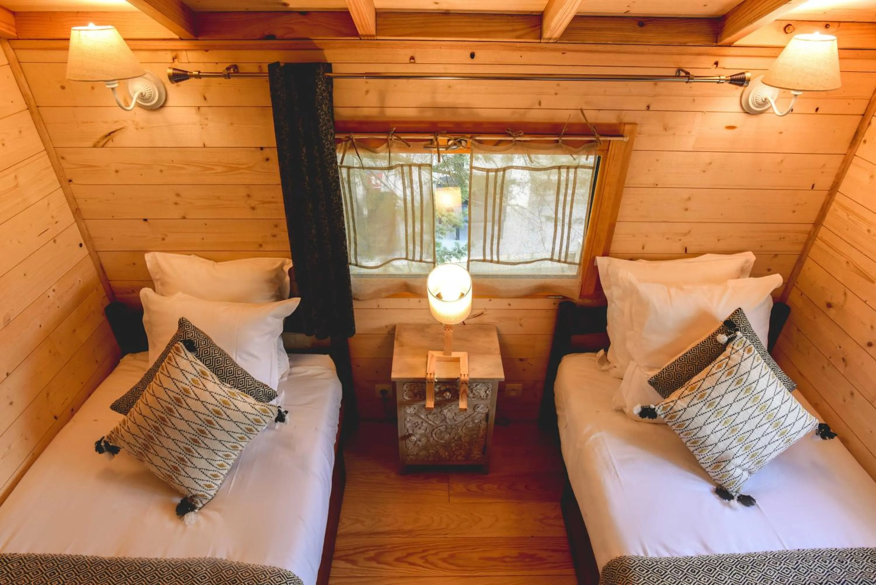 Bed in Logis Hôtel Emeraude des Bois