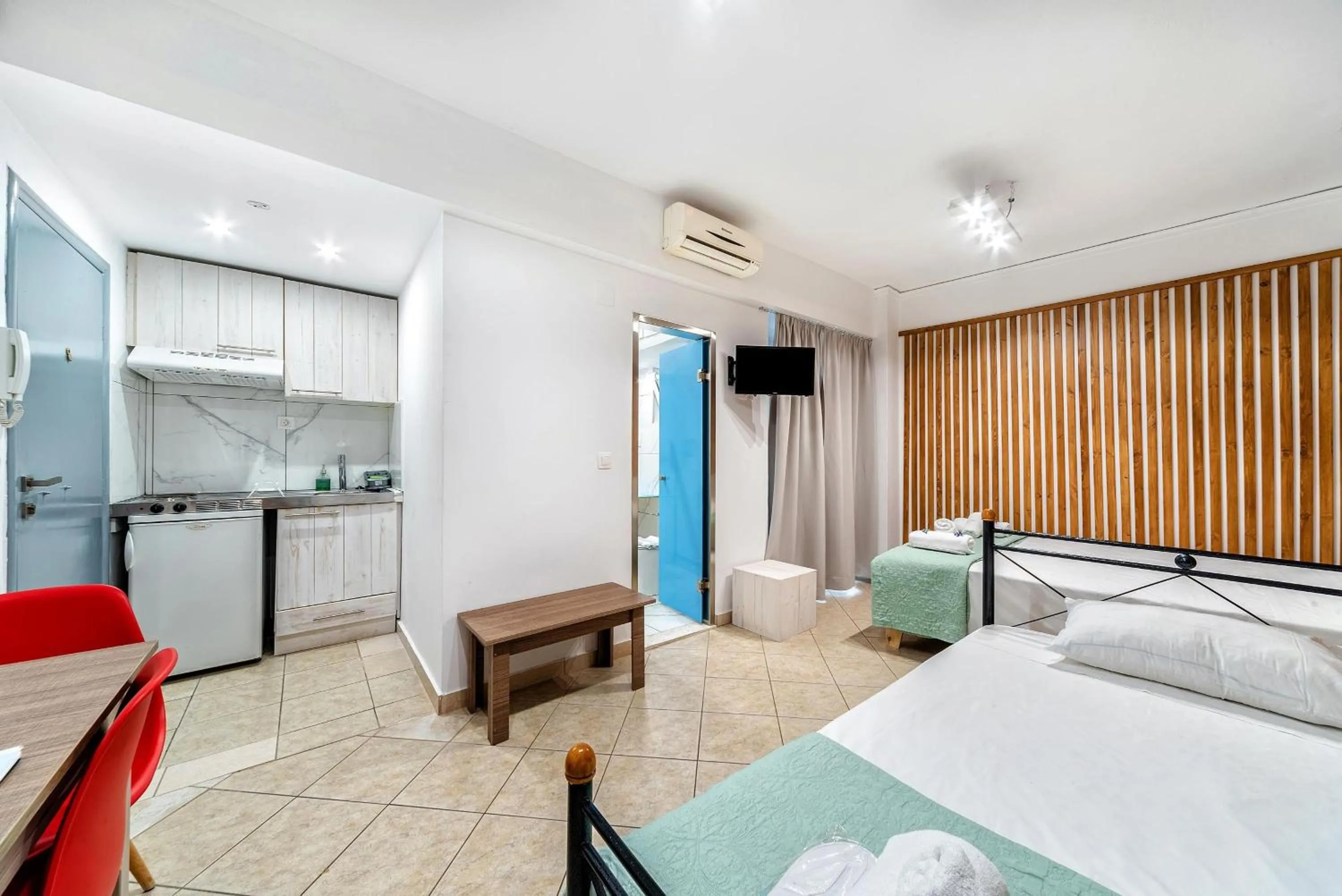 Bed in City Center Studios by Cretan Houses