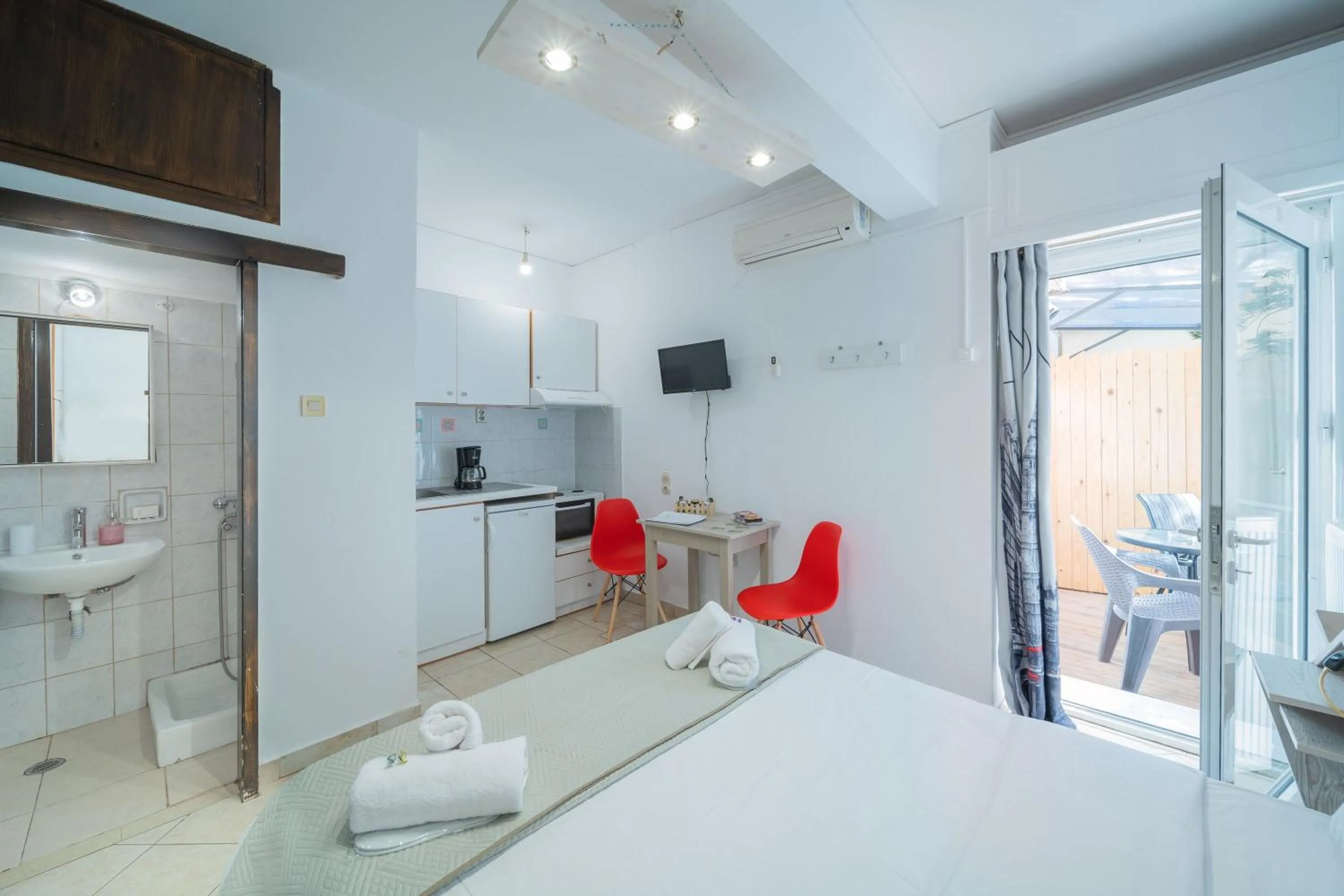 Bed in City Center Studios by Cretan Houses