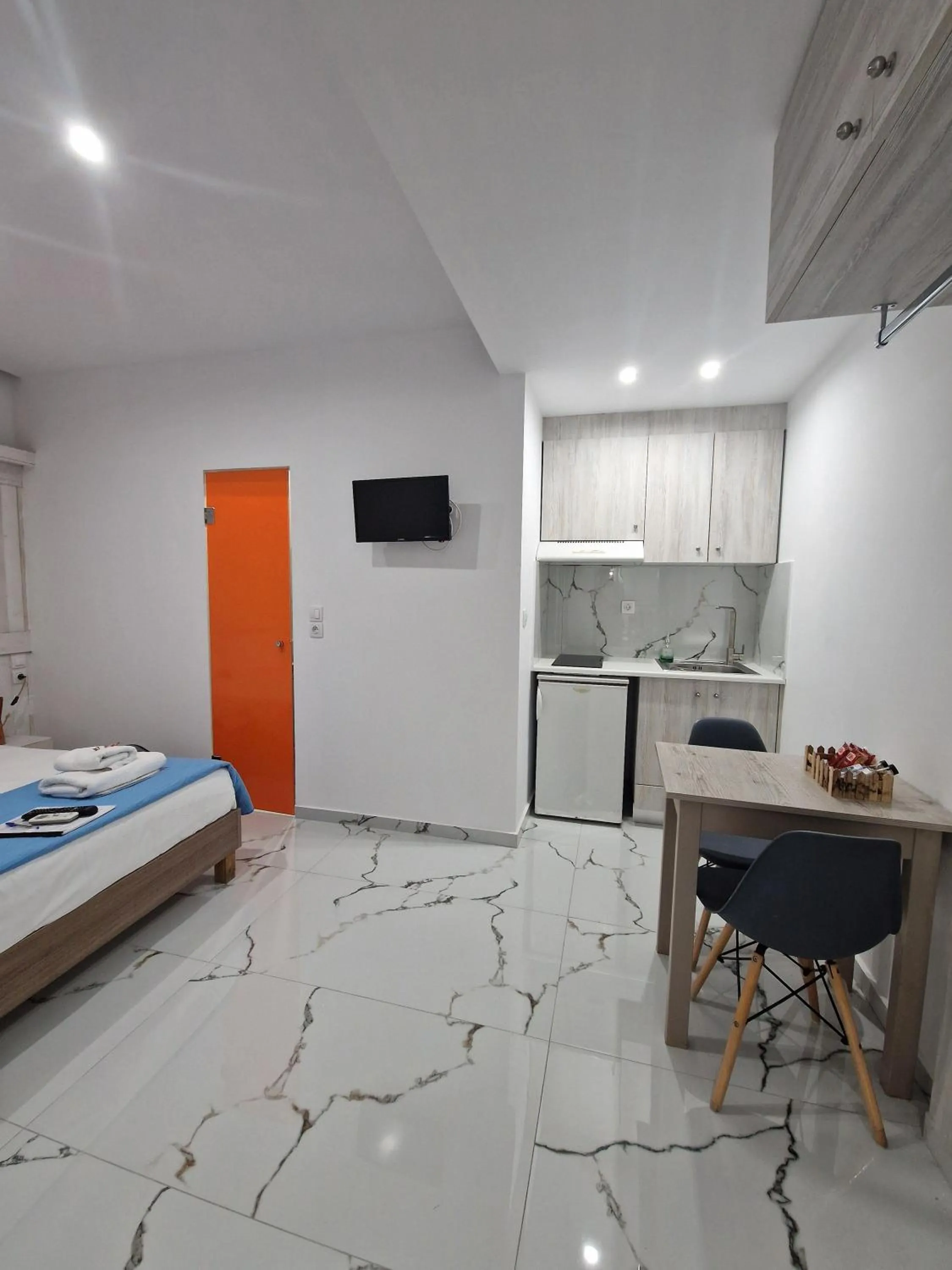 Bed in City Center Studios by Cretan Houses