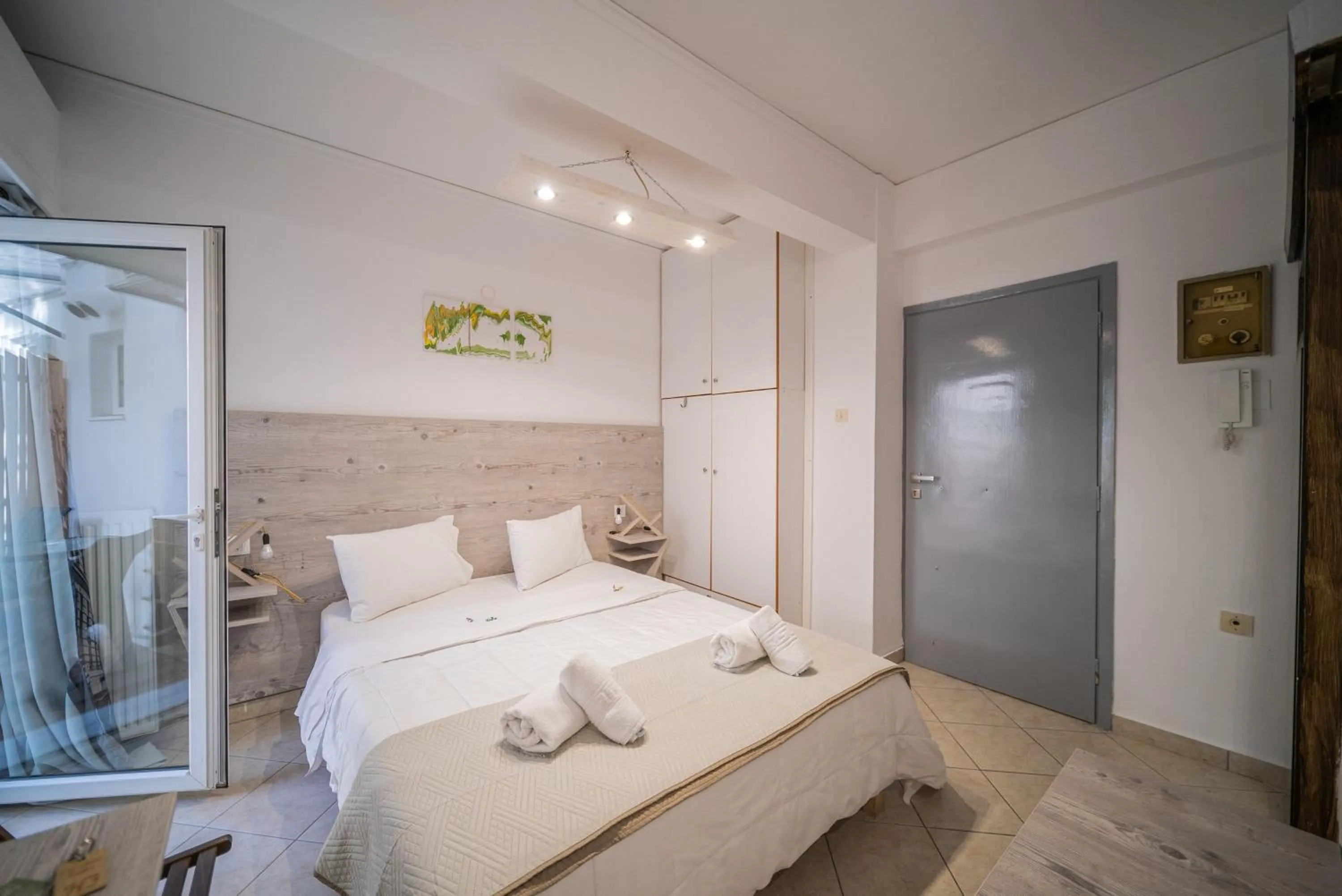 Bed in City Center Studios by Cretan Houses