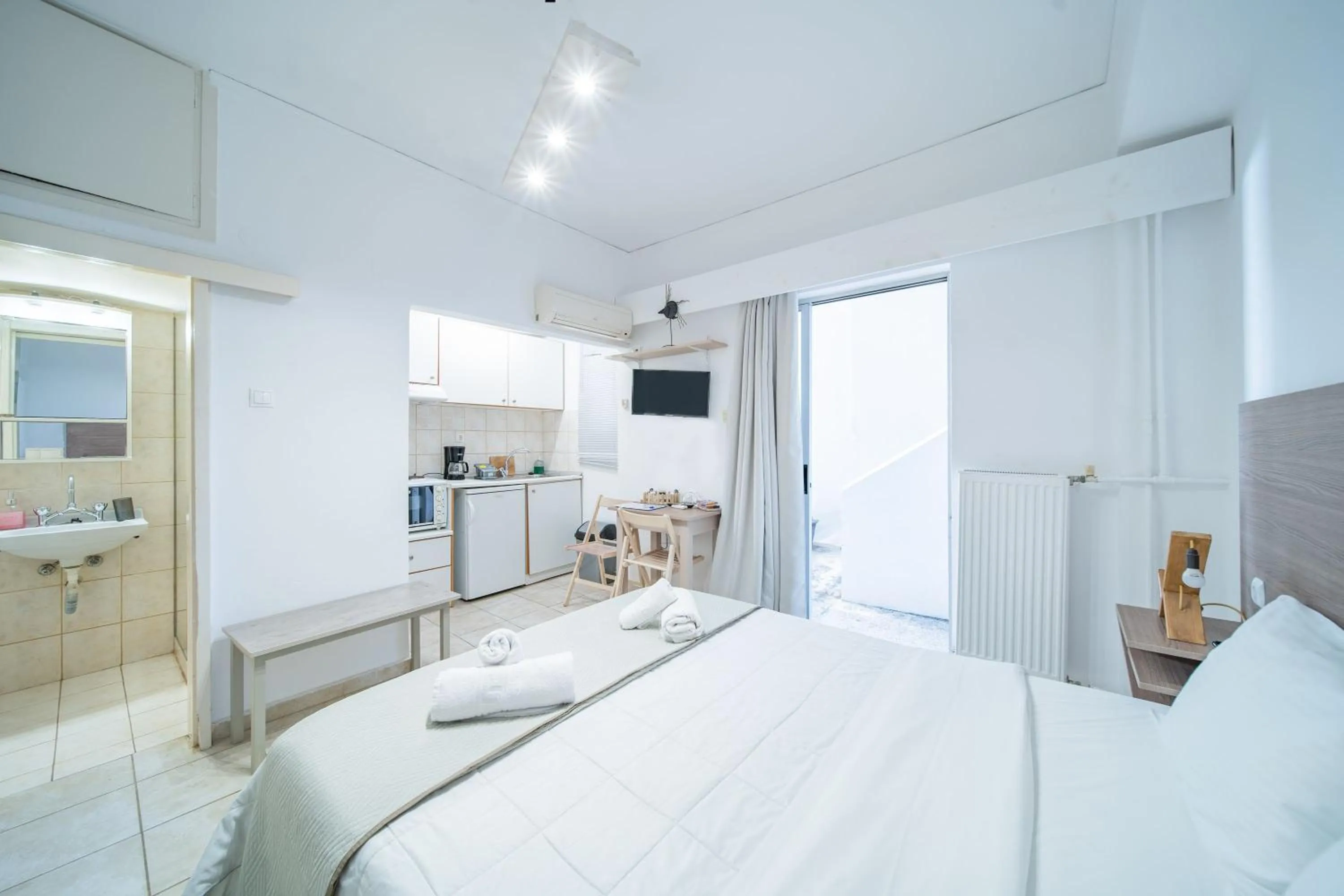 Bed in City Center Studios by Cretan Houses