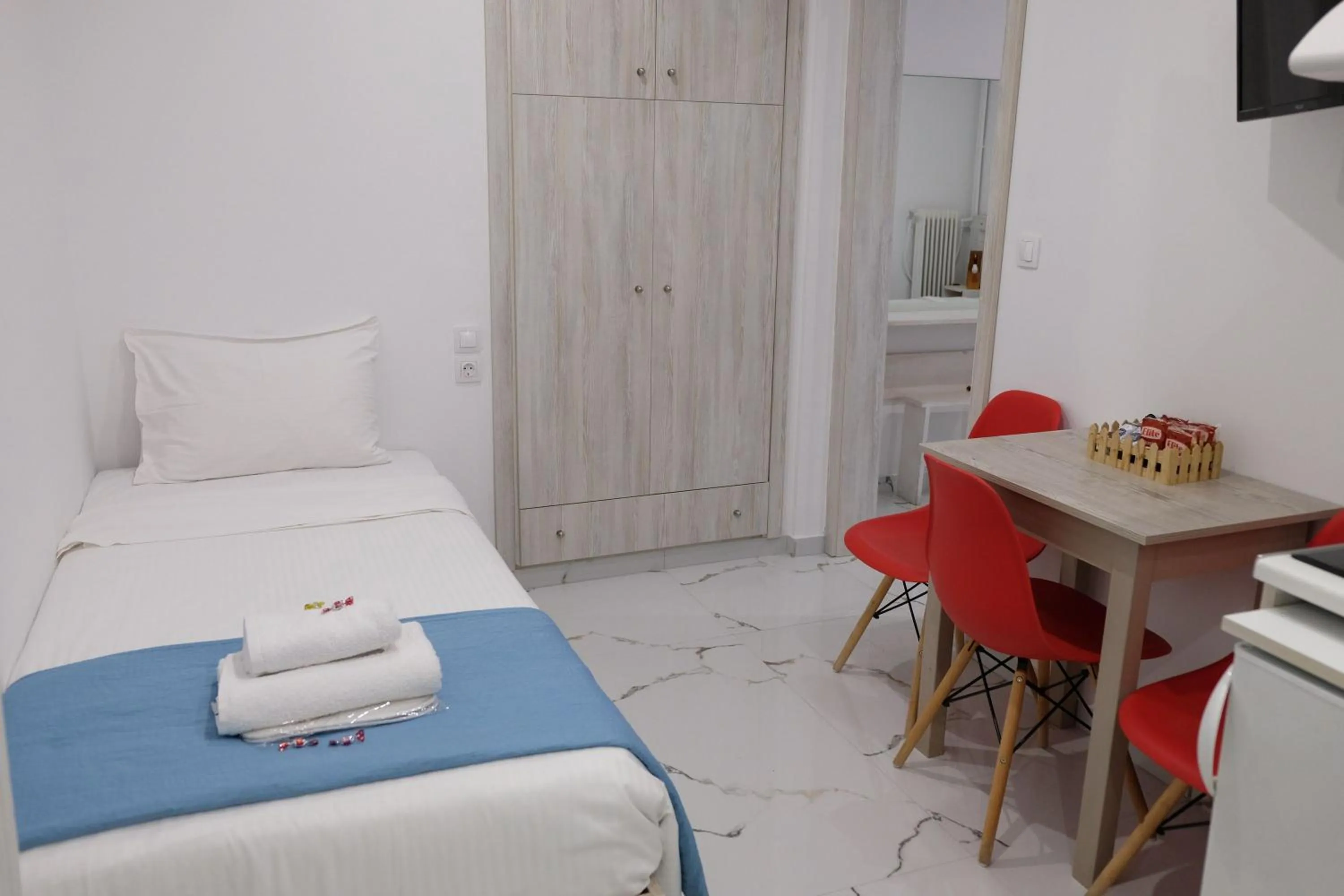 Bed in City Center Studios by Cretan Houses