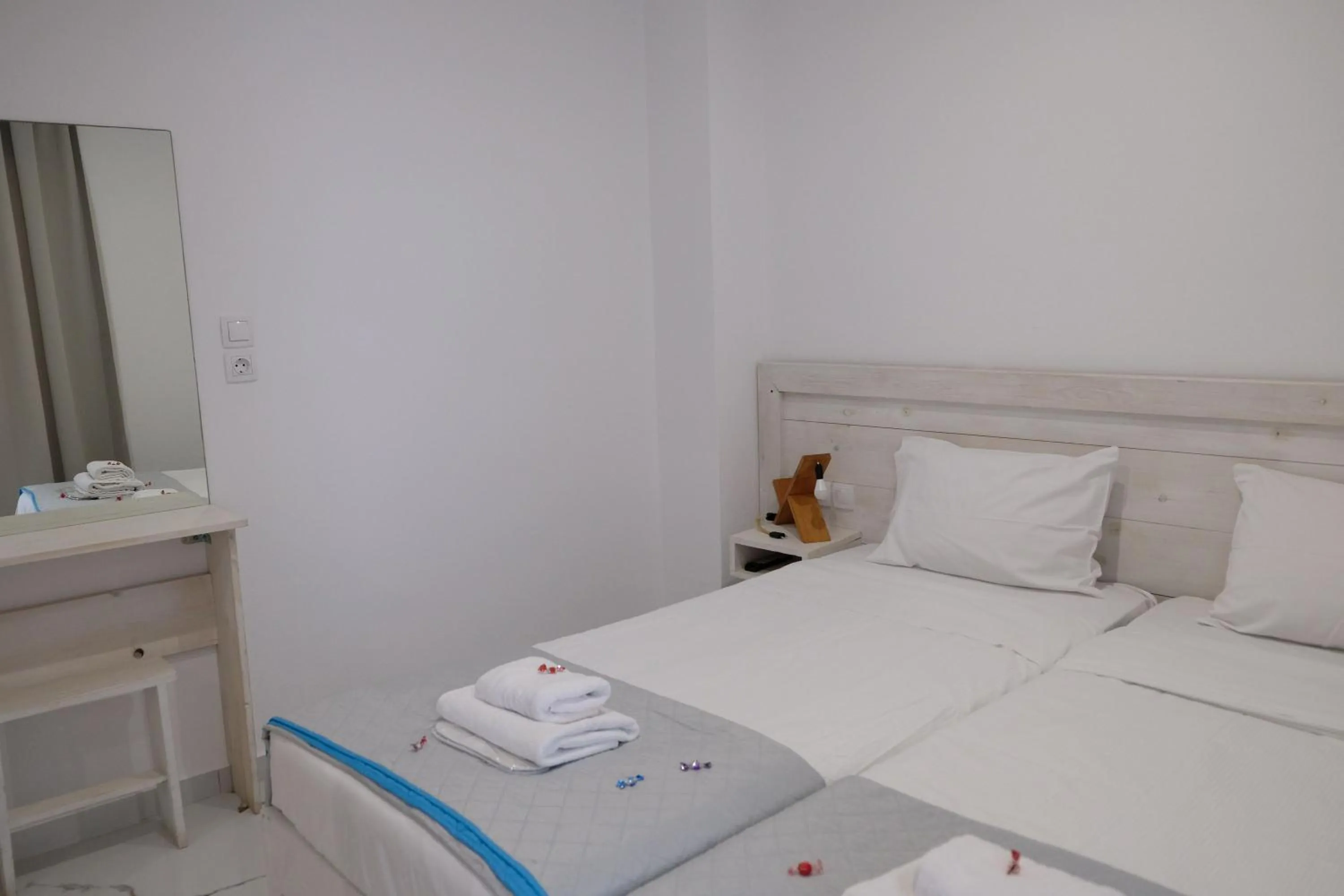 Bed in City Center Studios by Cretan Houses