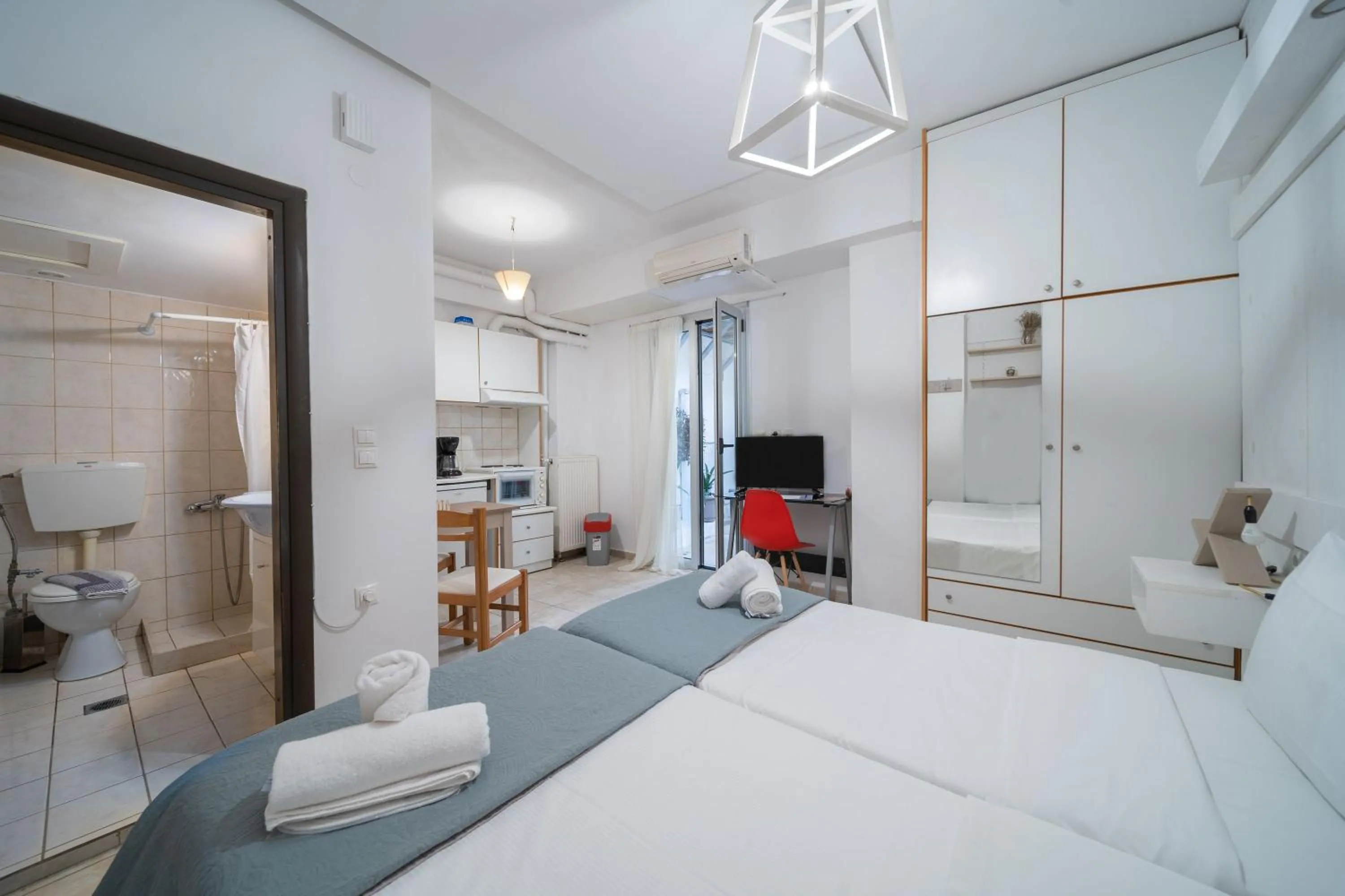 Bed in City Center Studios by Cretan Houses