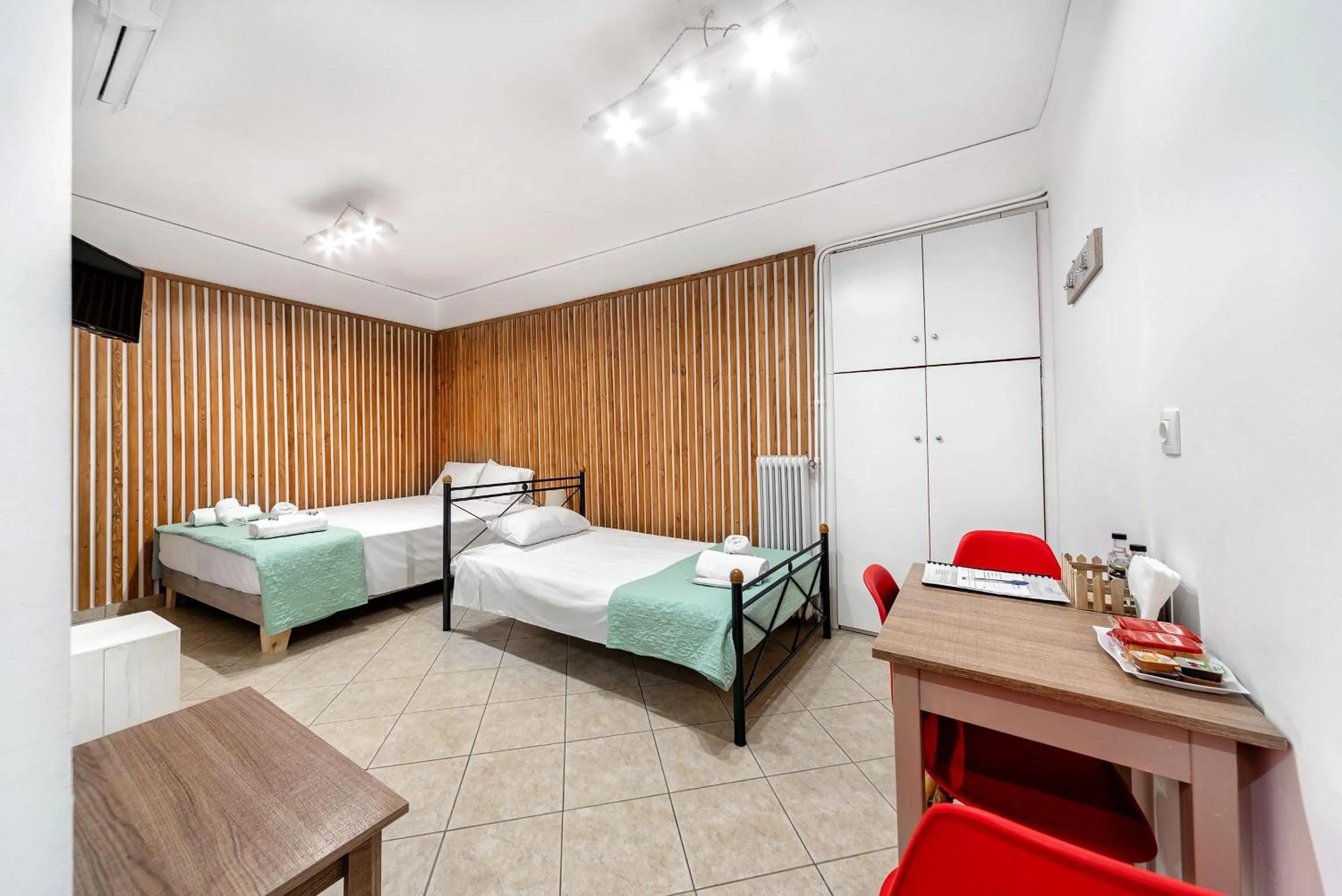 Bed in City Center Studios by Cretan Houses