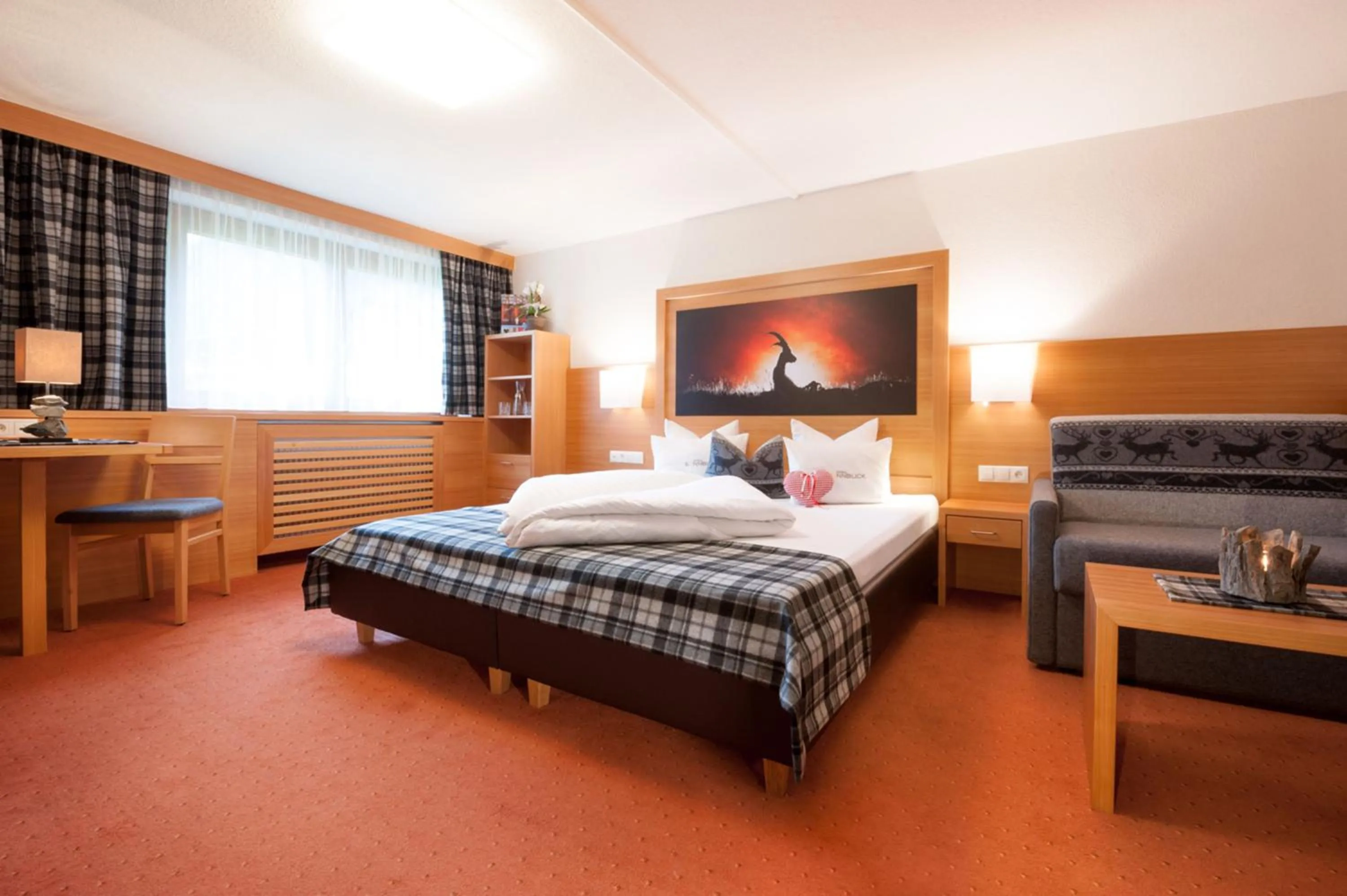 Bed in GenussHotel Sonnblick