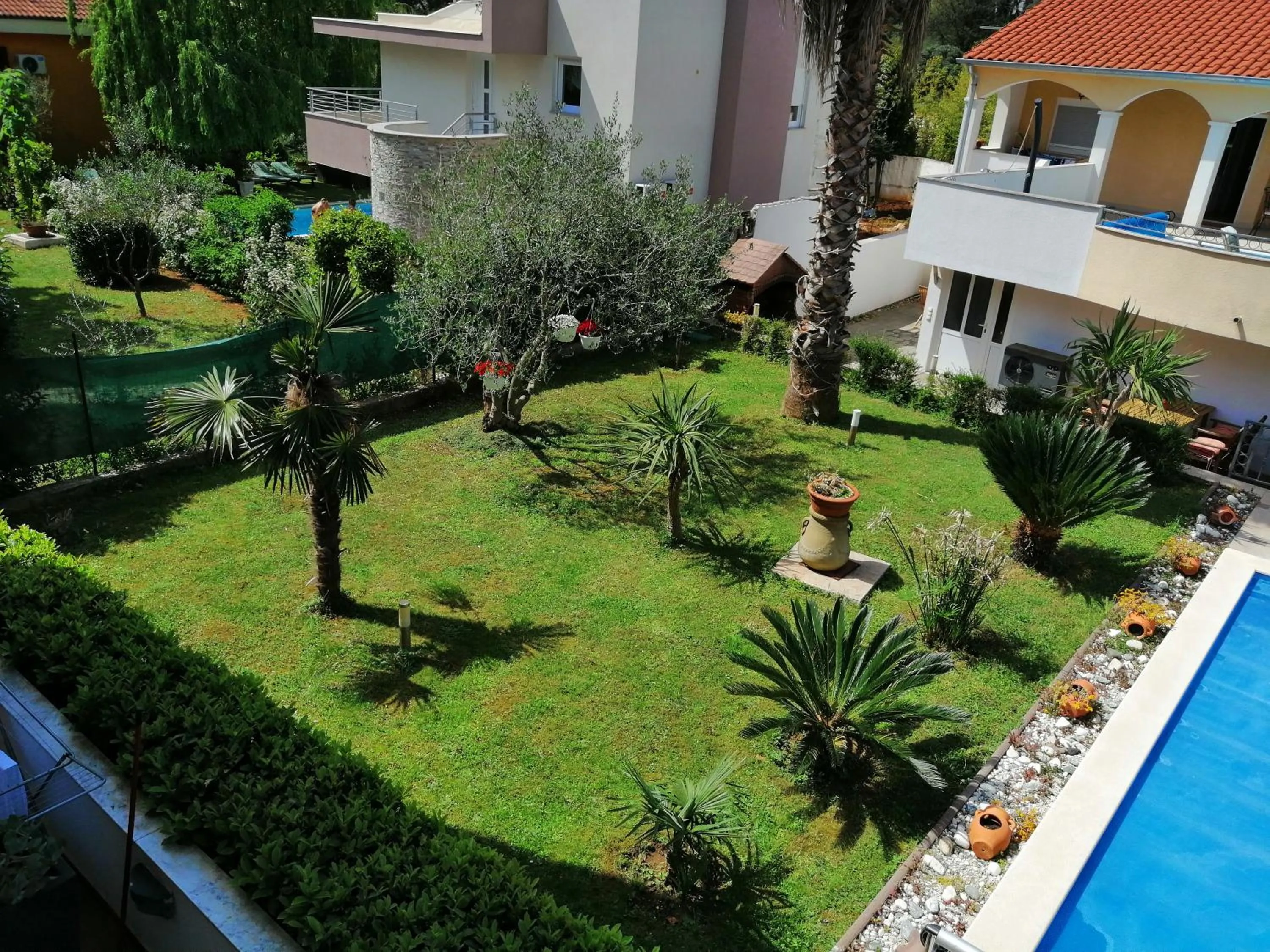 Garden in Villa Vanilla with Heated Pool