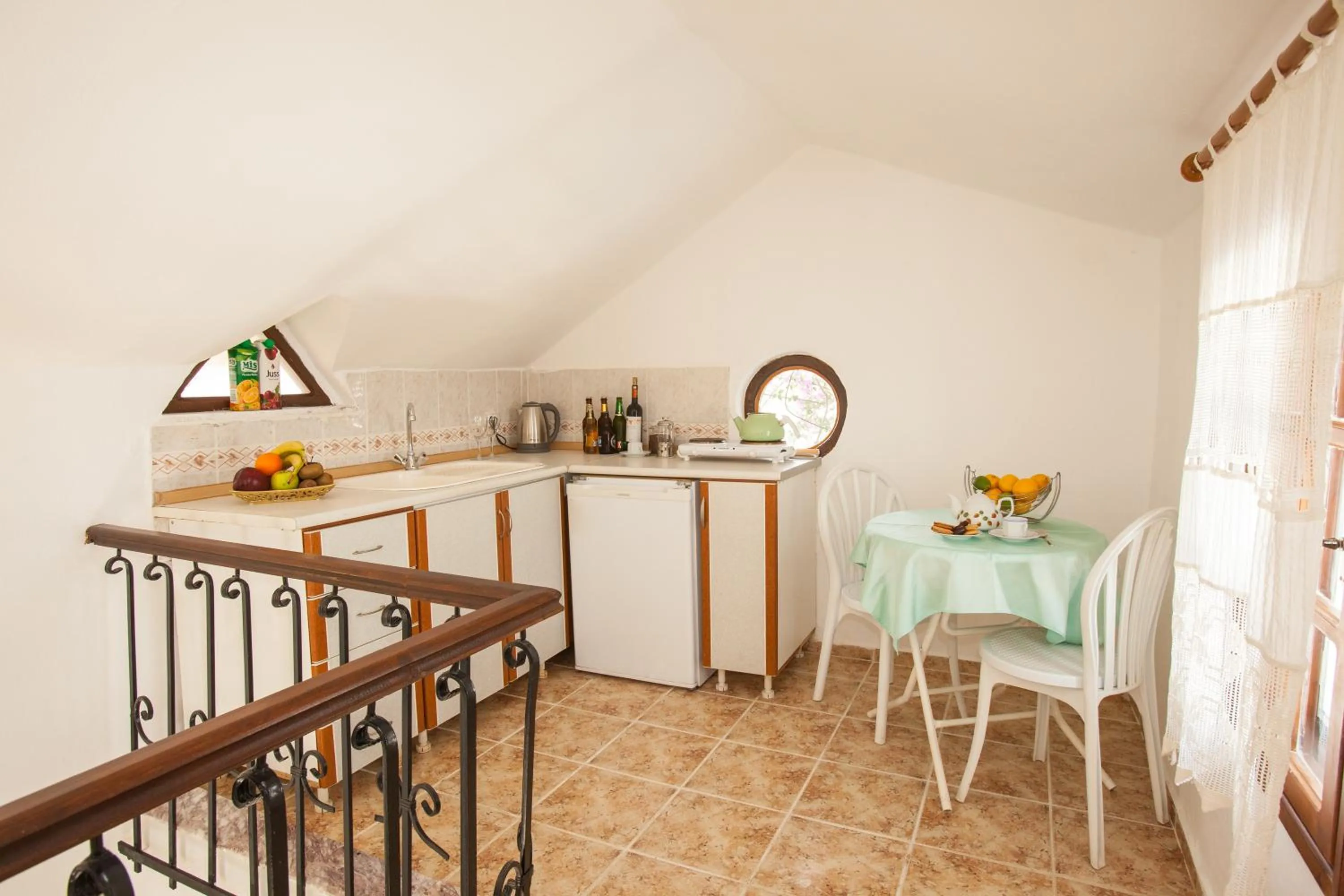 Kitchen or kitchenette in Papermoon Hotel & Apartments