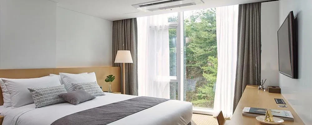 Bed in Naksan Beach Hotel