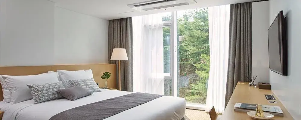 Bed in Naksan Beach Hotel Bed in Naksan Beach Hotel