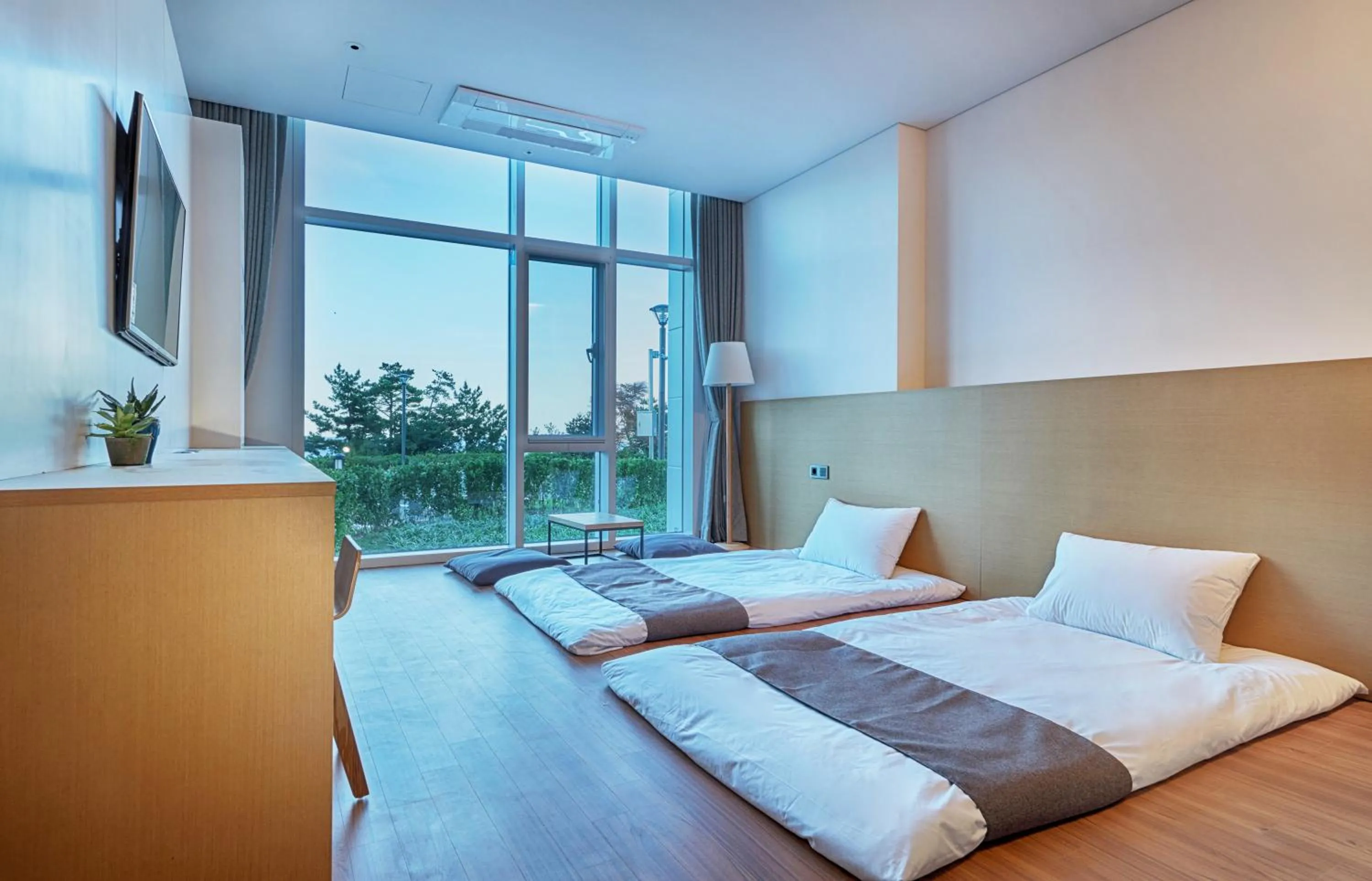 Bed in Naksan Beach Hotel