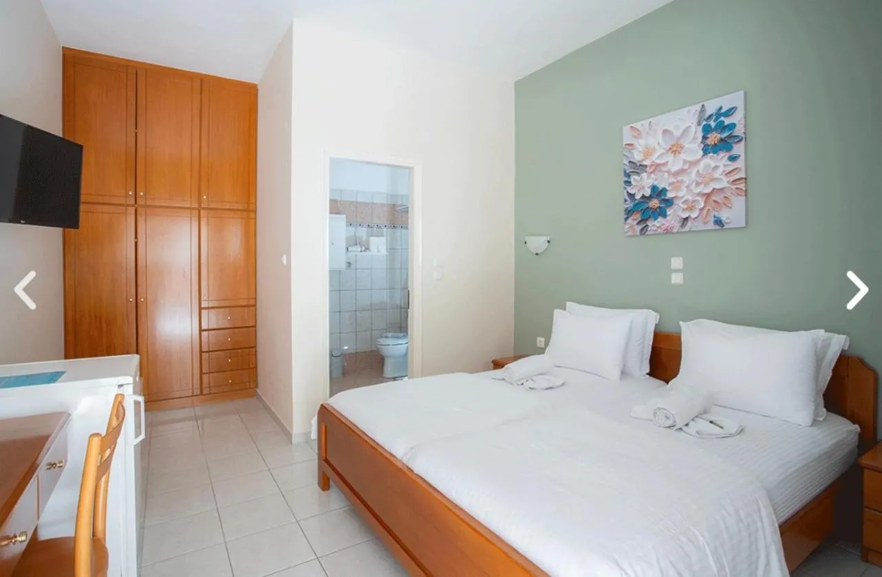 Bed in Geni Garden Apartments