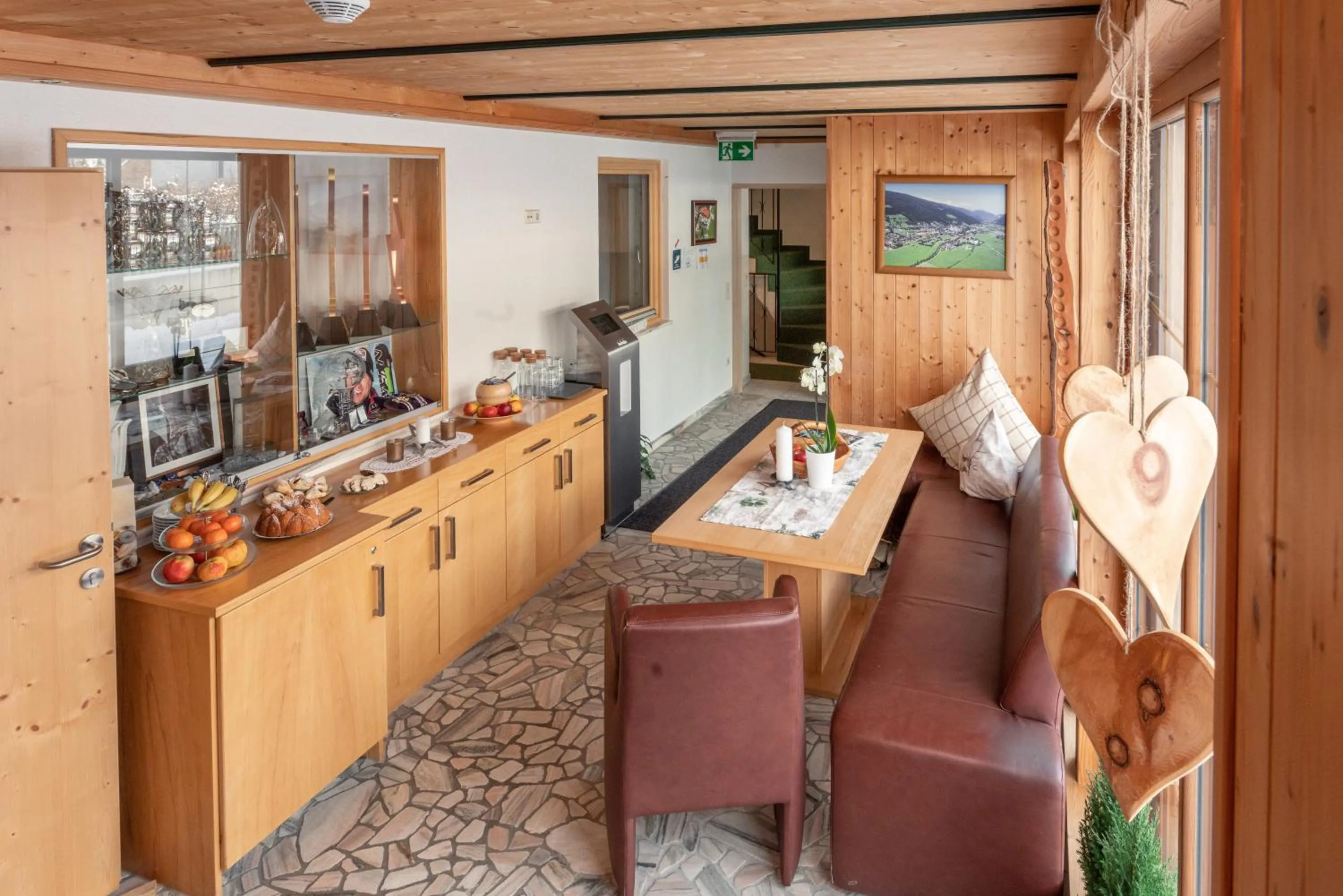 Communal lounge/ TV room in Wellnesshaus Reichelt