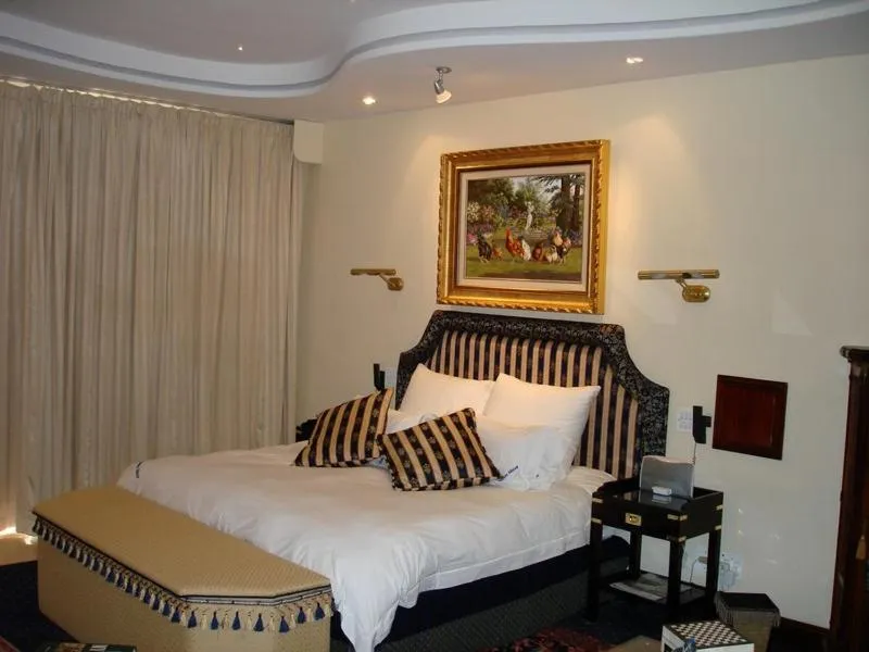 Bed in Kosmos Manor Guest House