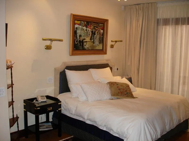 Bed in Kosmos Manor Guest House