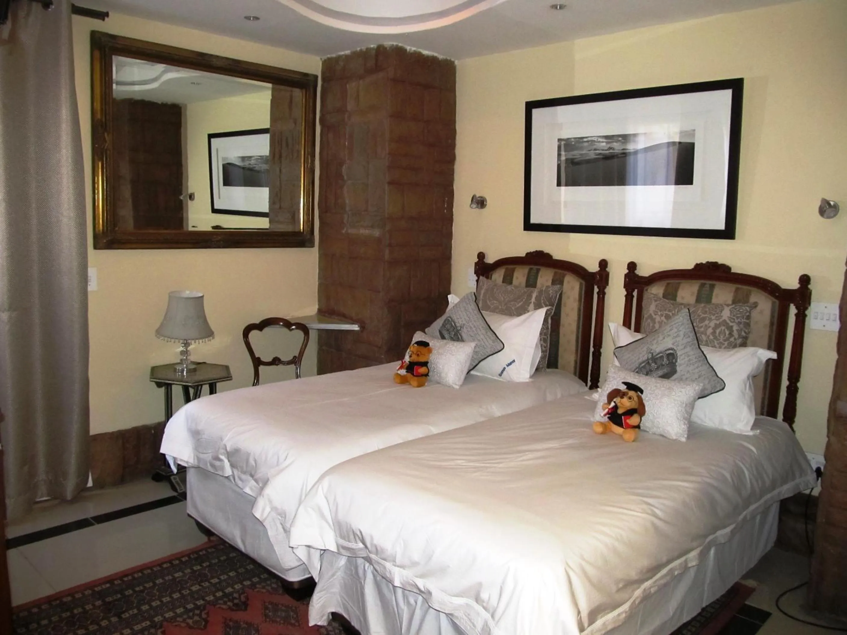 Bed in Kosmos Manor Guest House