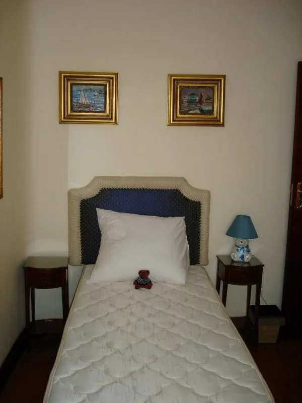 Bed in Kosmos Manor Guest House