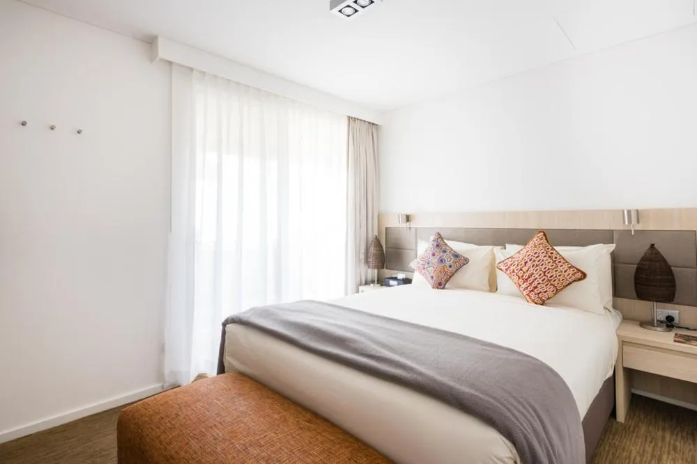 Bed in Emu Walk Apartments