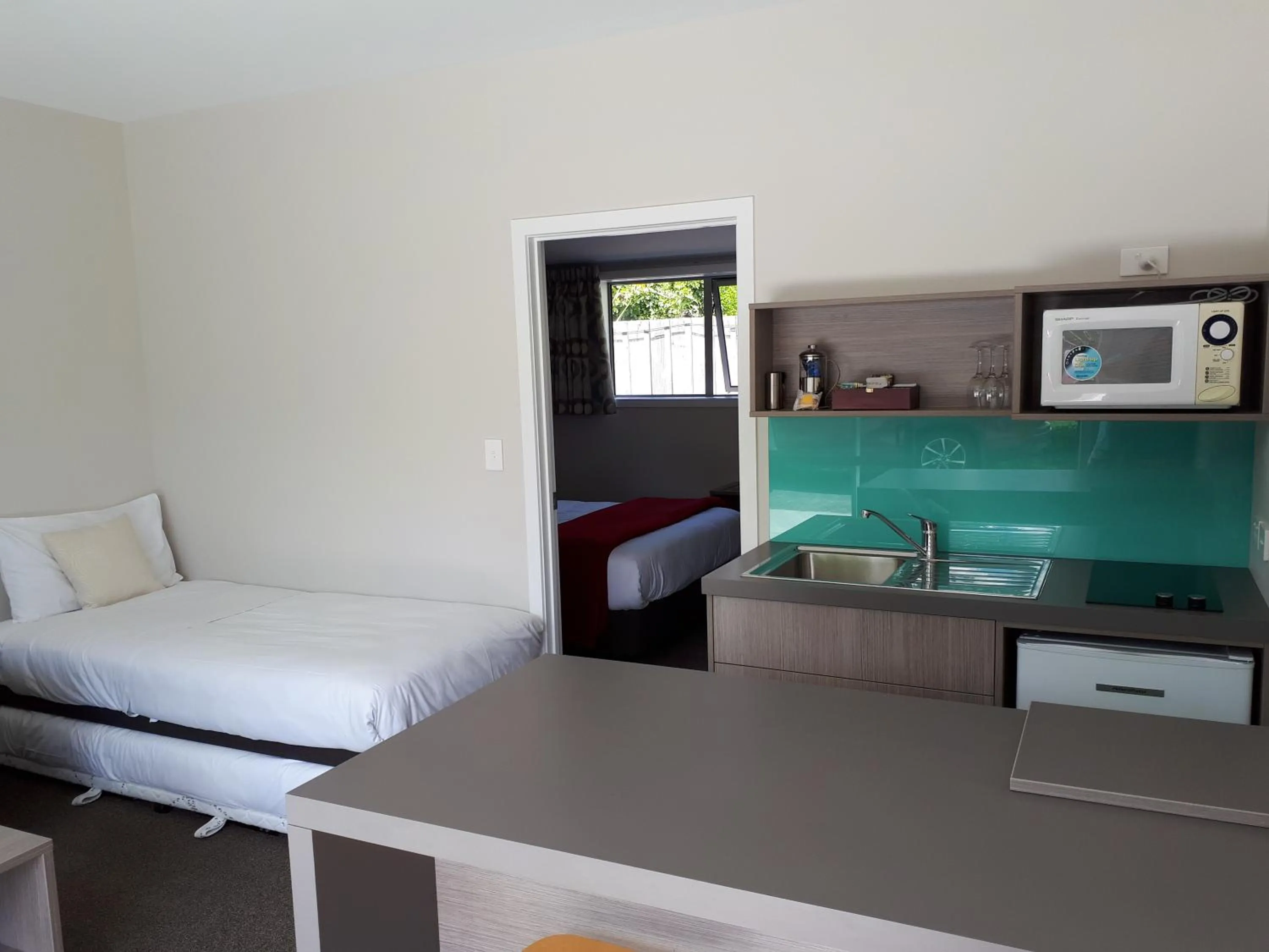 Bed in Edgewater Motel